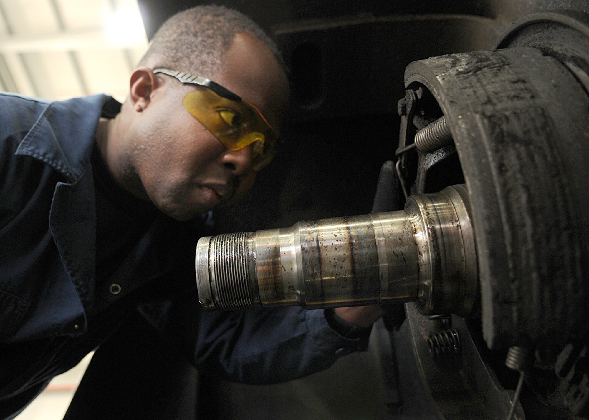 Staff Sgt. Samuel Cranston, a vehicle maintenance technician from the 100th Logistics Readiness Squadron, performs an annual inspection on the brakes of a forklift Dec. 18, 2008, at RAF Mildenhall, England. (U.S. Air Force photo by Staff Sgt. Jerry Fleshman) 