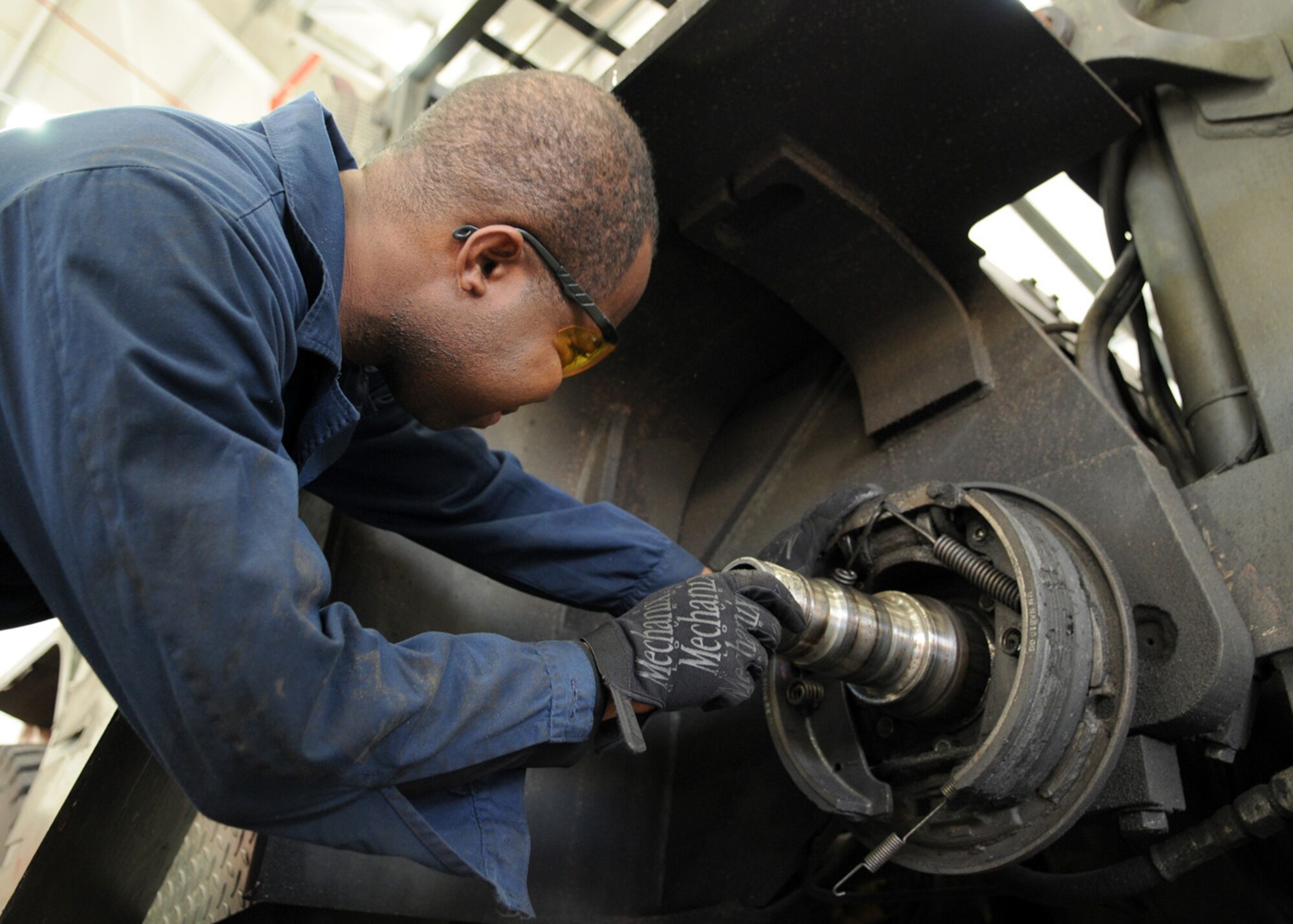 Staff Sgt. Samuel Cranston, a 100th Logistics Readiness Squadron vehicle maintenance technician, performs an annual inspection on the brakes of a forklift Dec. 18, 2008, at RAF Mildenhall, England. The vehicle maintenance squadron performs annual inspections on more than 640 government vehicles here, while also servicing and repairing vehicles daily. (U.S. Air Force photo by Staff Sgt. Jerry Fleshman) 