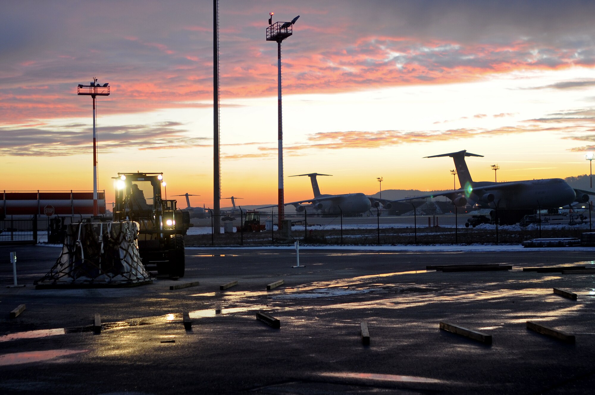 The first cargo pallet is put in place at the Joint Mobility Processing Center in support of an operational readiness exercise Jan. 13, 2009, at Ramstein Air Base. The exercise prepared Airmen stationed at Ramstein for real world missions and events. (U.S. Air Force photo by Airman 1st Class Kenny Holston)