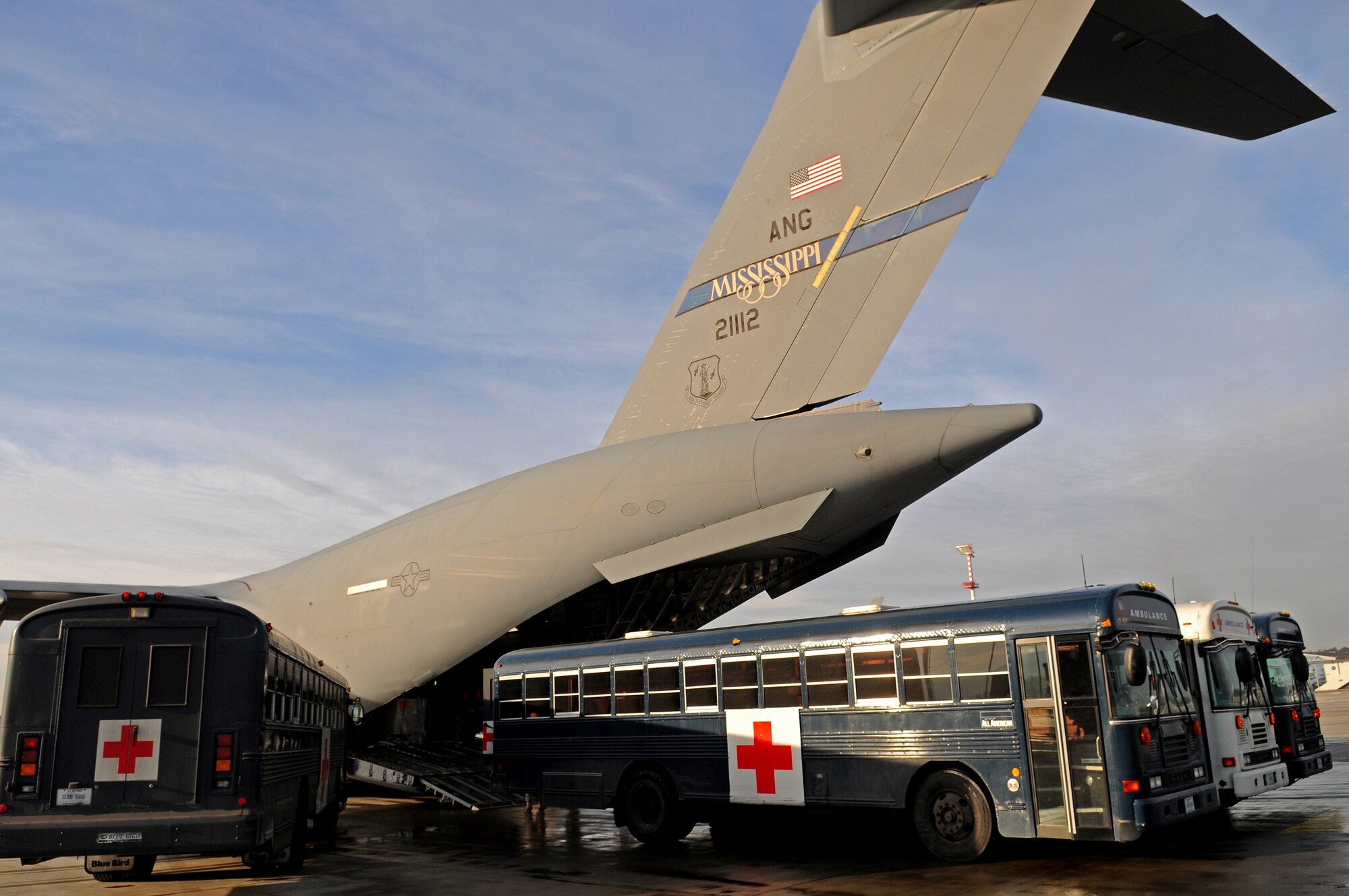 Air Force medical busses back up to a C-17 Globemaster III for patient-off load at Ramstein Air Base Jan. 13, 2009. Members from the 435th Contingency Aeromedical Staging Facility off-loaded more than 30 patients who were flown back from Balad Air Base, Iraq, after being wounded in battle. (U.S. Air Force photo by Grovert Fuentes-Contreras)