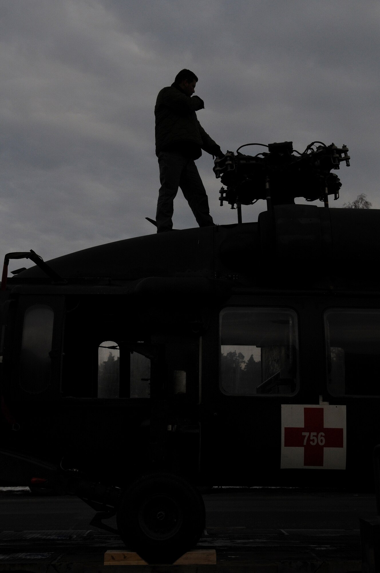 DynCorp International personnel prepare an Army Sikorsky UH-60 Black Hawk for transport to Coleman Barracks Jan. 13, 2009, from Ramstein Air Base. The Black Hawk was brought from Iraq to undergo special maintenance. (U.S. Air Force photo by Airman 1st Class Grovert Fuentes-Contreras)