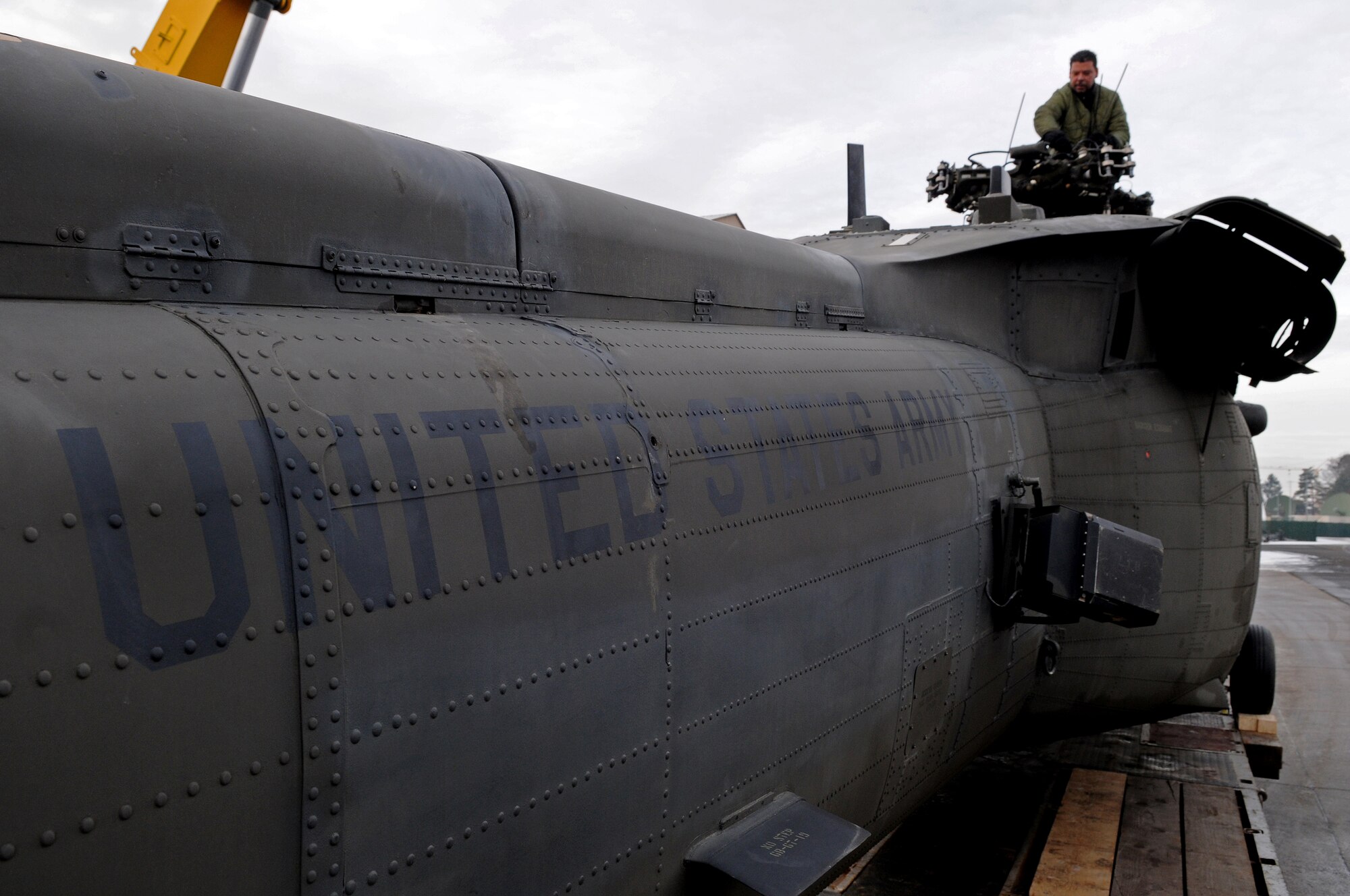 DynCorp International personnel prepare an Army Sikorsky UH-60 Black Hawk for transport to Coleman Barracks Jan. 13, 2009, from Ramstein Air Base. The Black Hawk was brought from Iraq to undergo special maintenance. (U.S. Air Force photo by Airman 1st Class Grovert Fuentes-Contreras)