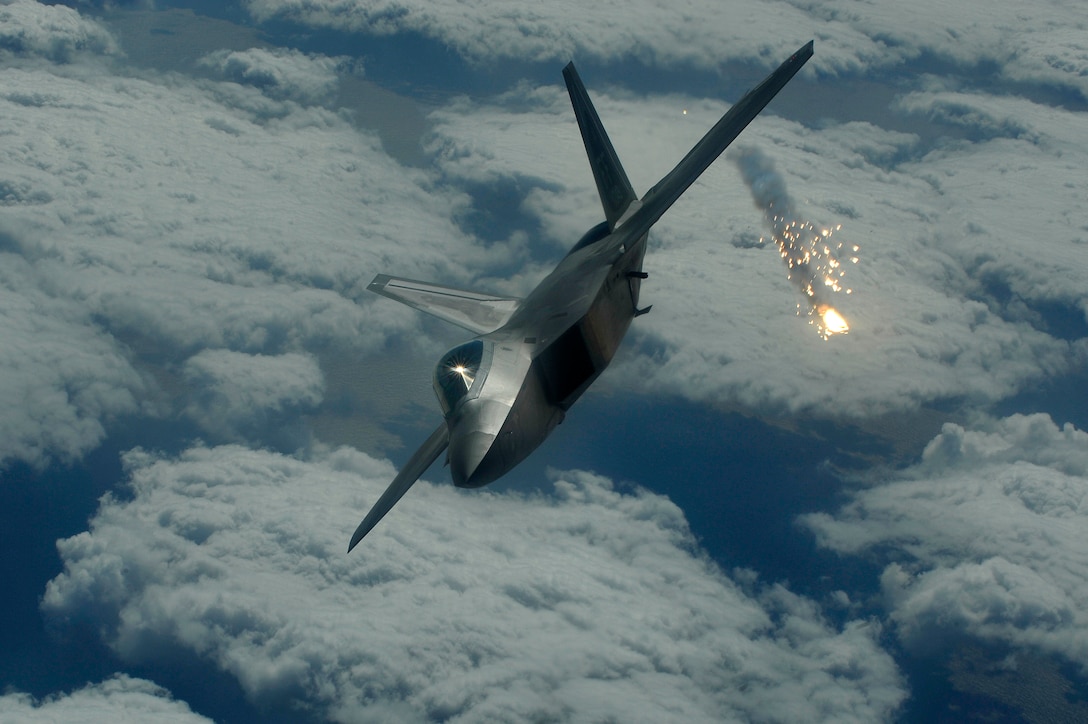 An F-22A Raptor shoots out a flare during an air combat training mission on Jan. 15. The F-22A is deployed to Kadena Air Base, Japan from the 27th Fighter Squadron Langley Air Force Base, Va. in support of U.S. Pacific Command.
(U.S. Air Force photo/Senior Airman Clay Lancaster)
