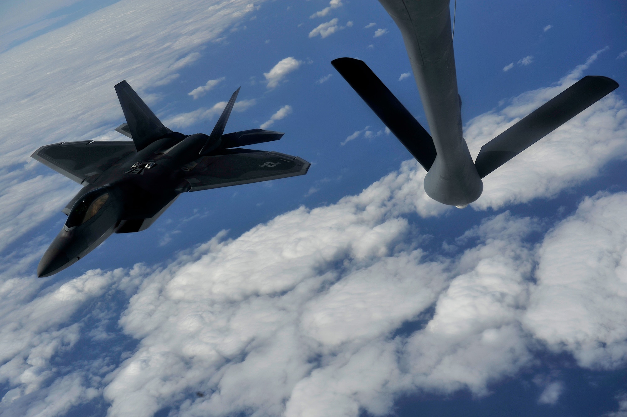 An F-22A Raptor awaits to refuel from a KC-135 Stratotanker on Jan. 15. The F-22A is deployed to Kadena Air Base, Japan from the 27th Fighter Squadron Langley Air Force Base, Va. in support of U.S. Pacific Command.
(U.S. Air Force photo/Senior Airman Clay Lancaster)