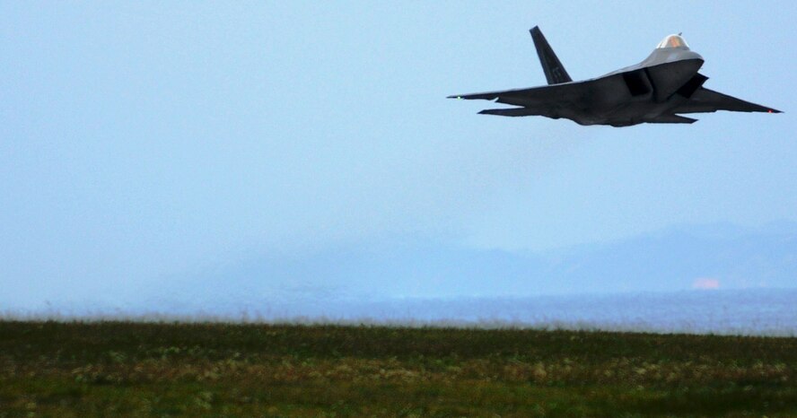 An F-22A Raptor takes off for a local mission on Jan. 14 at Kadena Air Base, Japan. The F-22A is deployed from the 27th Fighter Squadron Langley Air Force Base, Va. in support of U.S. Pacific Command. (U.S. Air Force photo/Airman 1st Class Amanda Grabiec)