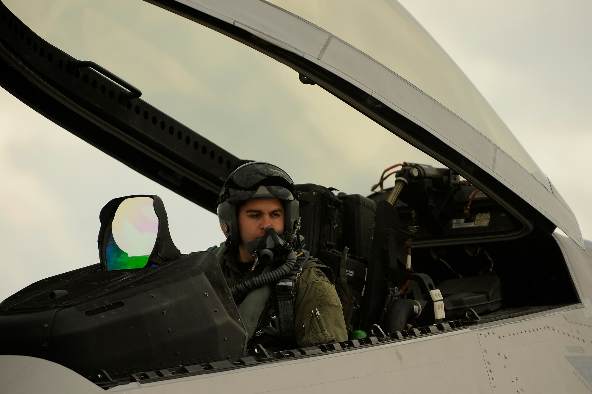 Capt. Jonathan Airhart, 27th Fighter Squadron pilot, waits for engine start while strapped in an F-22A Raptor prior to a local mission on Jan. 14 at Kadena Air Base, Japan. The F-22A is deployed from the 27th Fighter Squadron Langley Air Force Base, Va. in support of U.S. Pacific Command. (U.S. Air Force photo/Master Sgt. Andy Dunaway)