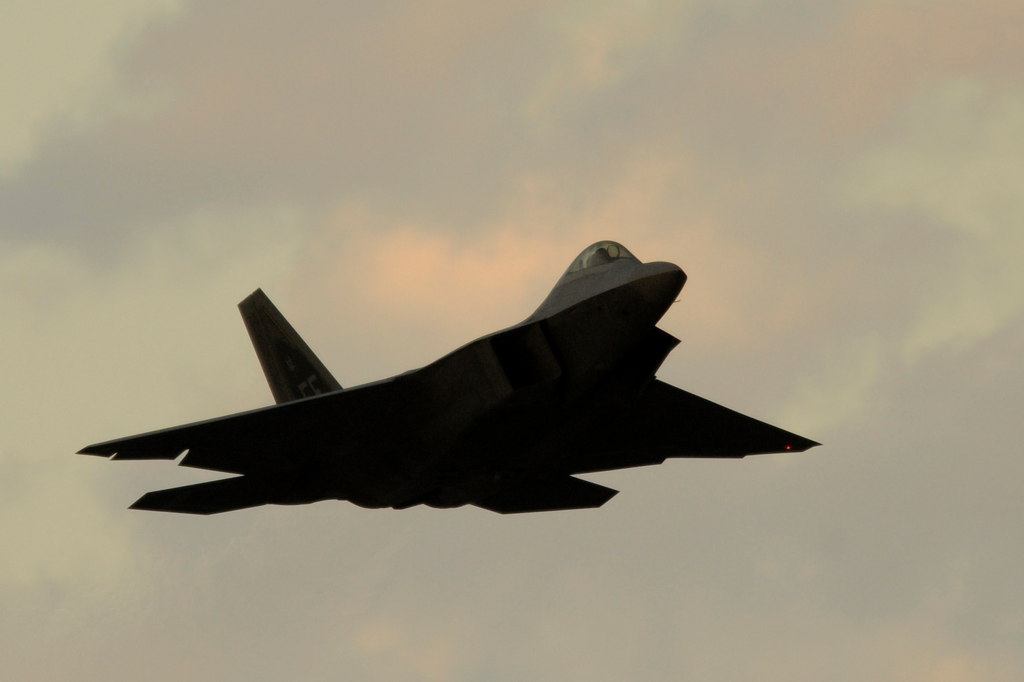 An F-22A Raptor takes off for a local mission at Kadena Air Base, Japan on Jan. 14. The F-22A is deployed from the 27th Fighter Squadron Langley Air Force Base, Va. in support of U.S. Pacific Command. (U.S. Air Force photo/Master Sgt. Andy Dunaway)