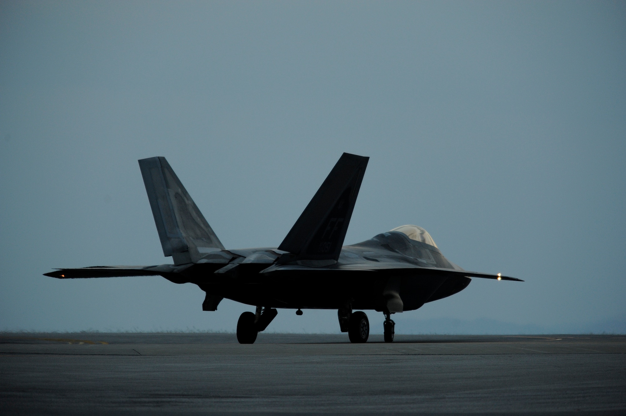 An F-22A Raptor taxis down the ramp for a local mission at Kadena Air Base, Japan on Jan. 14. The F-22A is deployed from the 27th Fighter Squadron Langley Air Force Base, Va. in support of U.S. Pacific Command. (U.S. Air Force photo/Master Sgt. Andy Dunaway)