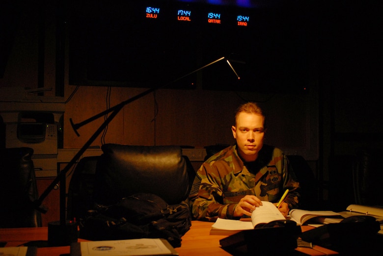 Master Sgt. Matthew Ulichney, 835th Civil Engineer Squadron, steals study breaks in the emergency operations center between the end of the duty day and his evening classes. Inspired by his former supervisor, Maj. Rodolfo Rodriguez, to go back to school, he finished two degrees with the Community College of the Air Force in December and is already enrolled in a bachelor’s program. Major Rodriguez was killed in a terrorist bombing in Pakistan last September. (U.S. Air Force photo by Capt John Ross)