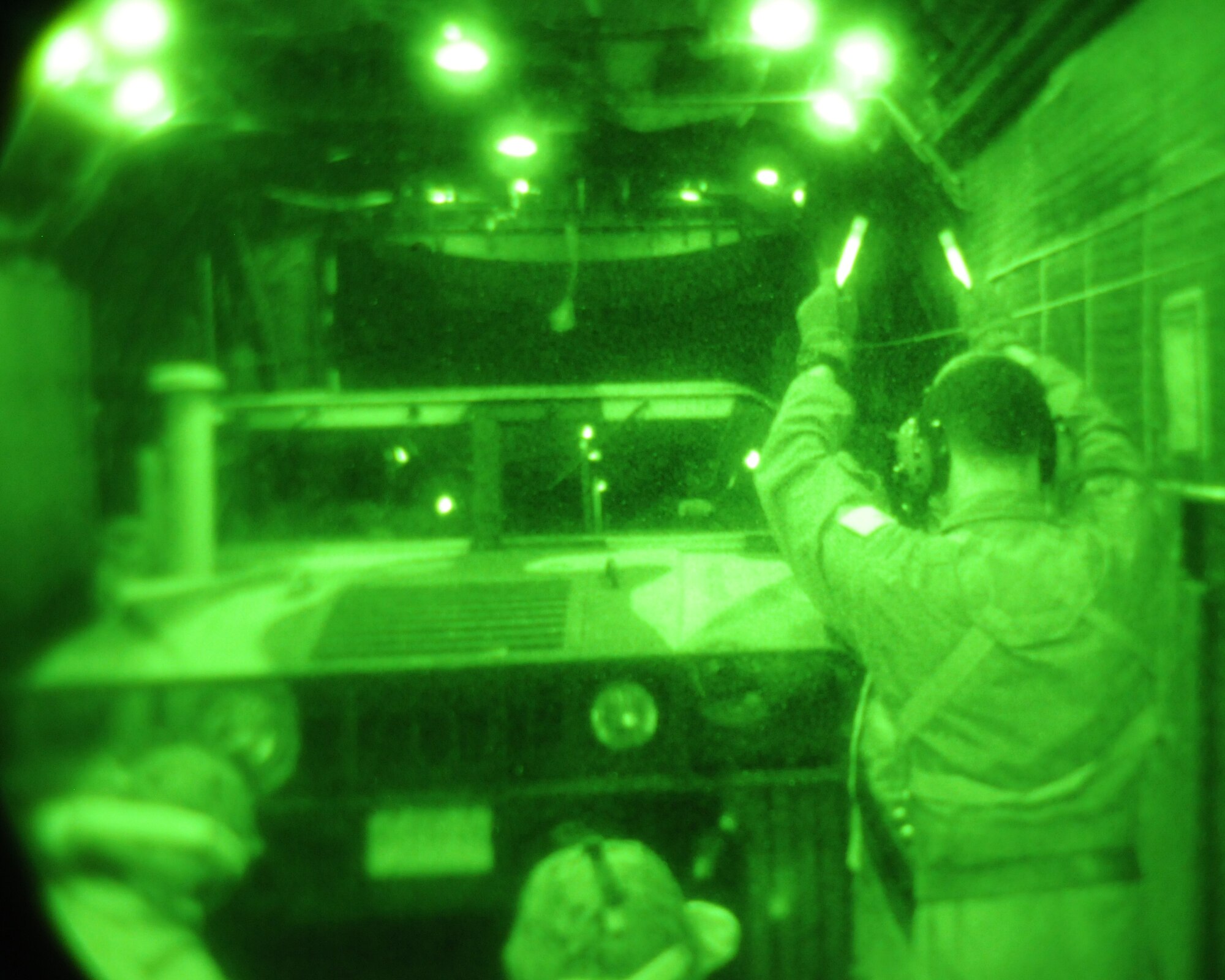 KADENA AIR BASE, Japan -- Senior Airman Jerred Sevold, a loadmaster with the 1st Special Operations Squadron, directs the driver of a high mobility multi-purpose wheeled vehicle, or HMMWV, onto a MC-130H Combat Talon II during a training exercise with Marines from the 31st Marine Expeditionary Unit Detachment 18 at Ie Shima Island Jan. 14. Crews from the 1st SOS constantly train with U.S. and allied forces to hone their capabilities to infiltrate, exfiltrate and resupply forces in austere, denied or hostile territory. (U.S. Air Force photo by Tech. Sgt. Aaron Cram)
