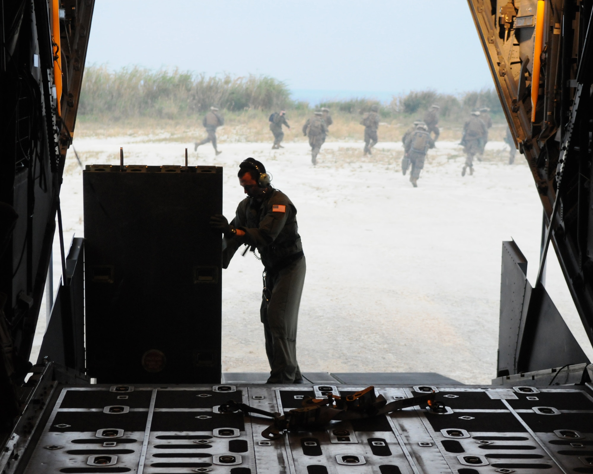 KADENA AIR BASE, Japan -- Senior Airman Jerred Sevold, a loadmaster with the 1st Special Operations Squadron, folds a ramp on a MC-130H Combat Talon II after offloading Marines from the 31st Marine Expeditionary Unit Detachment 18 during a training exercise at Ie Shima Island Jan. 14. Crews from the 1st SOS constantly train with U.S. and allied forces to hone their capabilities to infiltrate, exfiltrate and resupply forces in austere, denied or hostile territory. (U.S. Air Force photo by Tech. Sgt. Aaron Cram)