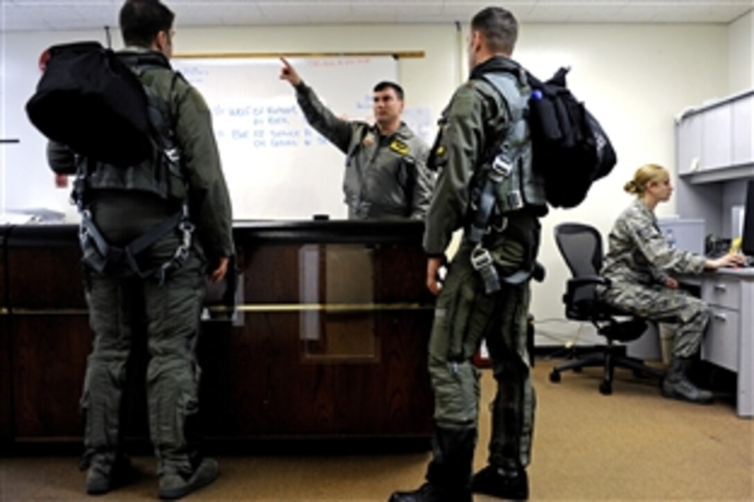 U.S. Air Force Capt. Phil Lancaster briefs F-22A Raptor aircraft pilots prior to a mission on Kadena Air Base, Japan, Jan. 14, 2009. Lancaster is deployed from the 27th Fighter Squadron out of Langley Air Force Base, Va.