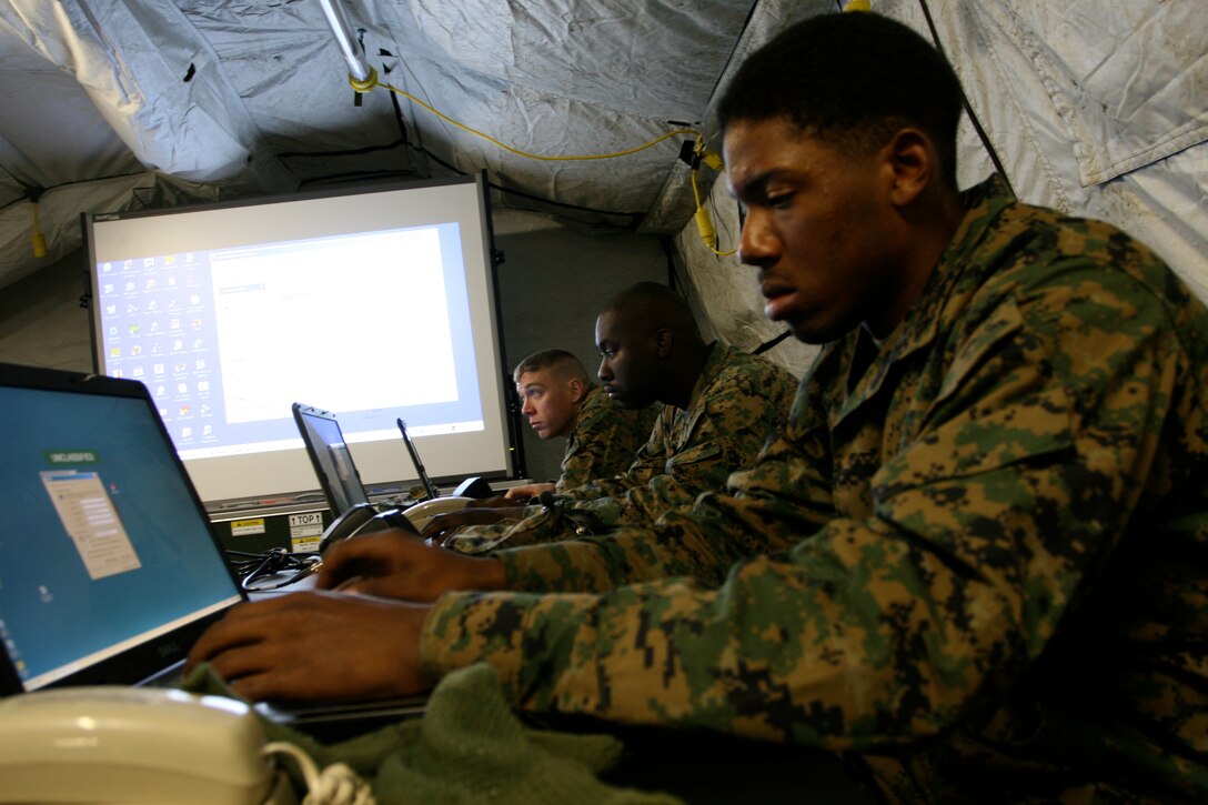 Marines train on computers set up by Marine Wing Support Squadron 171. The recently-constructed tents provided coverage from low temperatures and high winds.