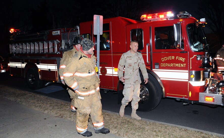 Senior Airman Derek Larson, 436th Civil Engineer Squadron and City of Dover volunteer firefighter, was greeted by fellow City of Dover firefighters who, with the help of local law enforcement, escorted Airman Larson home from the Delaware-Maryland state line Jan. 16. Airman Larson returned from a deployment to Joint Base Balad, Iraq, the same day. (U.S. Air Force photo/Tech. Sgt. Kevin Wallace)