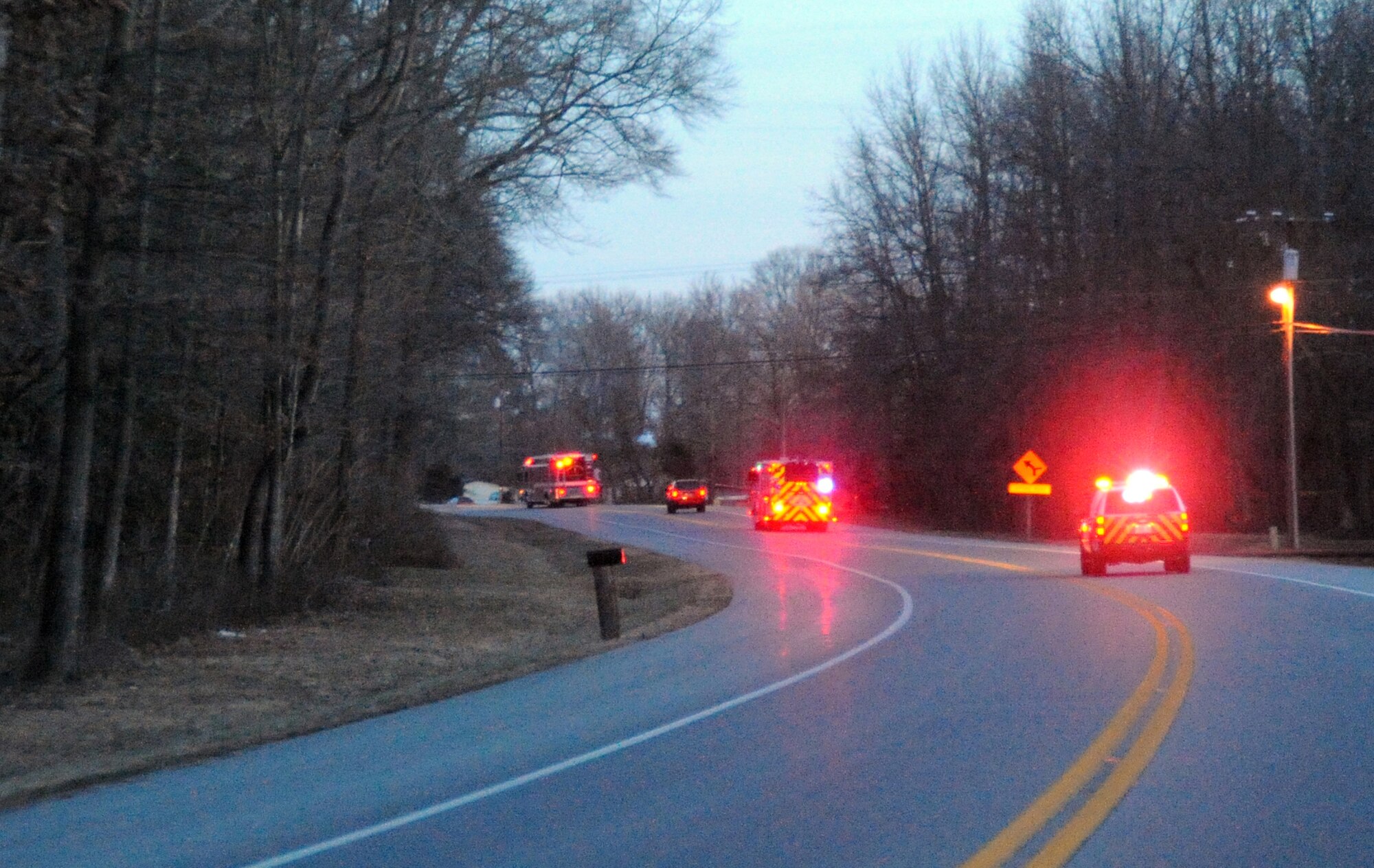 A convoy of three City of Dover fire engines escort Senior Airman Derek Larson, 436th Civil Engineer Squadron and City of Dover volunteer firefighter, home after his arrival from his deployment to Joint Base Balad, Iraq, Jan. 16. In all, five fire trucks took part in greeting Airman Larson but two were recalled to a real-world call. (U.S. Air Force photo/Tech. Sgt. Kevin Wallace)