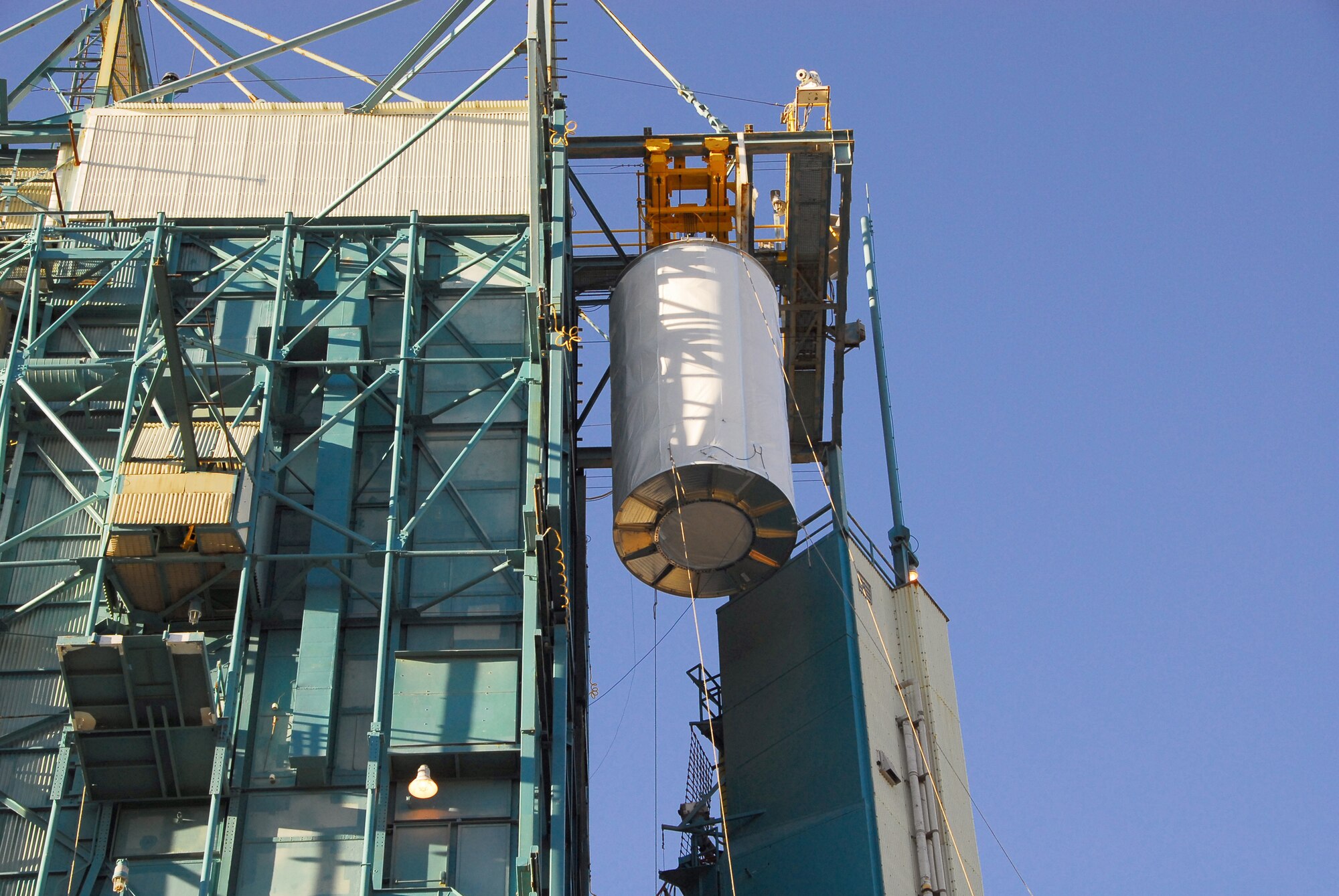 VANDENBERG AIR FORCE BASE, Calif. --  A National Oceanic and Atmospheric Administration weather satellite is raised into position for mate to Vandenberg's Delta II rocket. The rocket is scheduled to launch Feb. 4.