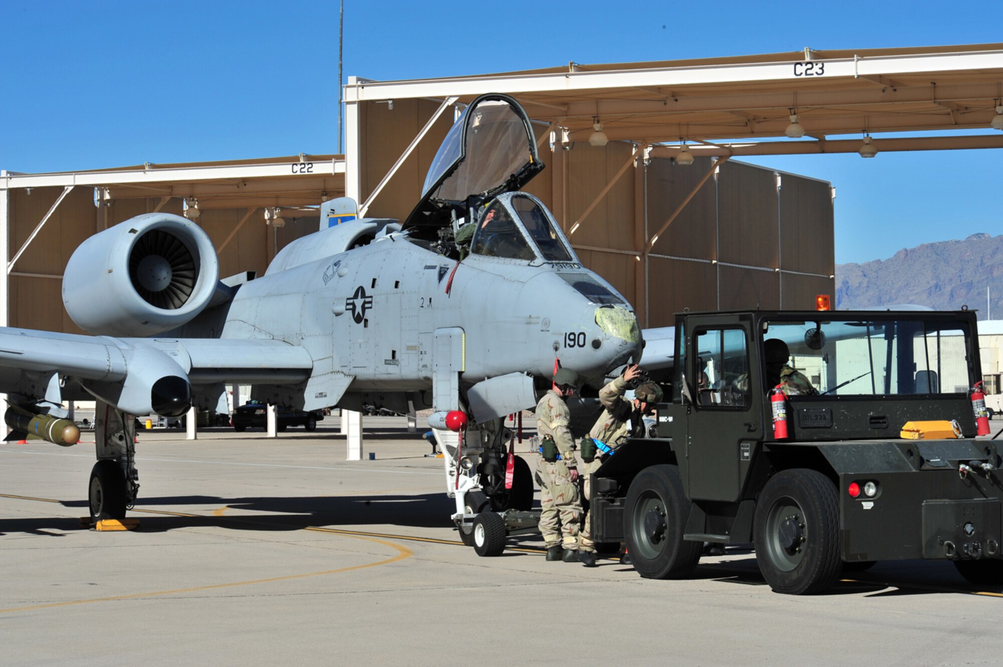 Members of the 355th Aircraft Maintenance Squadron connect a tow bar to an A-10 Thunderbolt II during the Phase II Operational Readiness Exercise here Jan. 15. (U.S. Air Force photo/Senior Airman Noah R. Johnson)