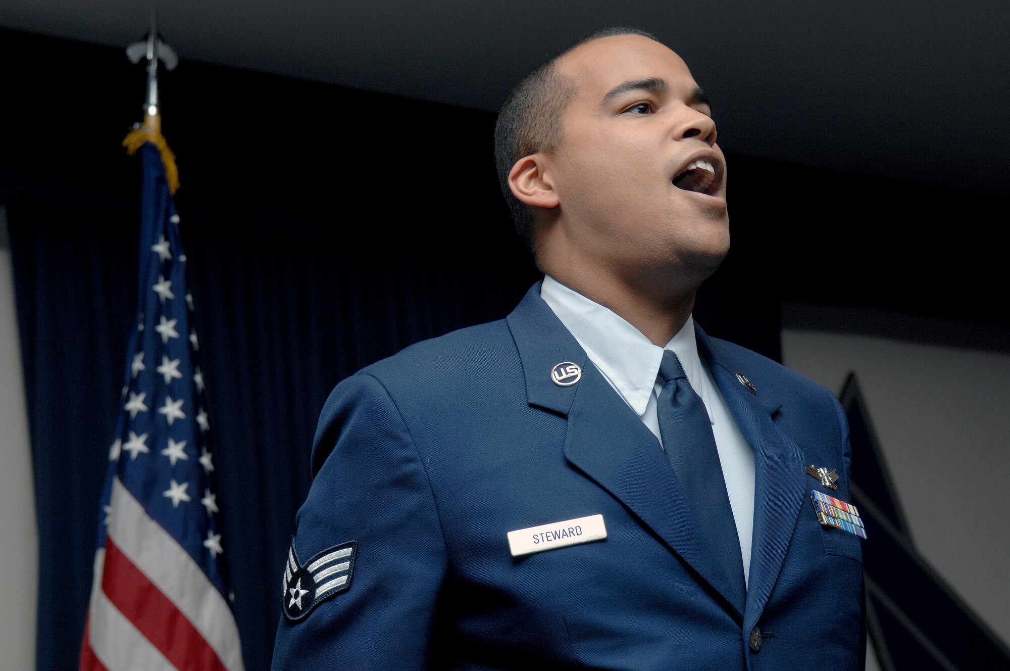 Senior Airman William Steward, 4th Space Control Squadron, sings the National Anthem during the Martin Luther King, Jr. observance luncheon at Holloman Air Force Base, N.M., Jan. 15. More than 100 people attended the luncheon that celebrated Mr. King?s patriotism and contributions to the United States. (U.S. Air Force photo/Senior Airman Anthony Nelson)