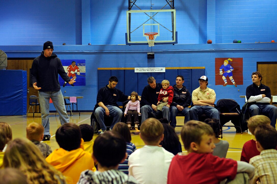 Jamie VanderVeeken of the Rapid City Rush hockey team speaks to children at the Ellsworth Youth Center here, Jan. 15. Mr. VanderVeeken explained the importance of good sportsmanship and leadership. (US Air Force photo/Airman 1st Class Corey Hook)