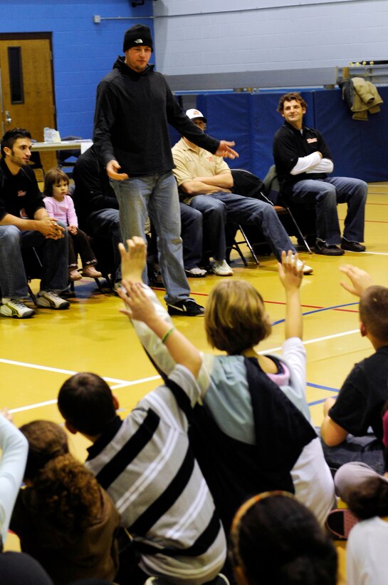 Jamie VanderVeeken of the Rapid City Rush hockey team speaks to children at the Ellsworth Youth Center here, Jan. 15. Mr. VanderVeeken explained the importance of good sportsmanship and leadership. (US Air Force photo/Airman 1st Class Corey Hook)