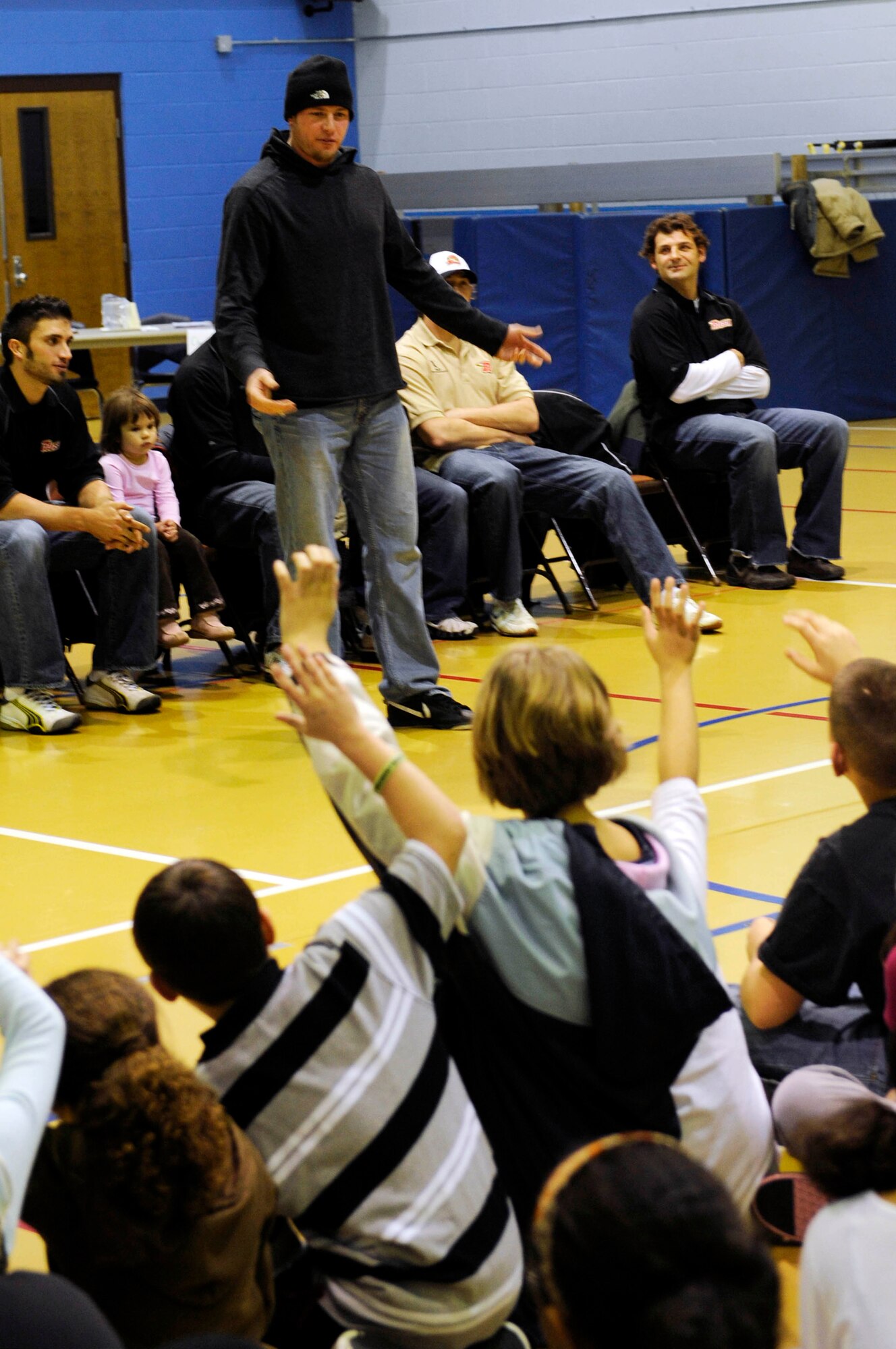 Jamie VanderVeeken of the Rapid City Rush hockey team speaks to children at the Ellsworth Youth Center here, Jan. 15. Mr. VanderVeeken explained the importance of good sportsmanship and leadership. (US Air Force photo/Airman 1st Class Corey Hook)