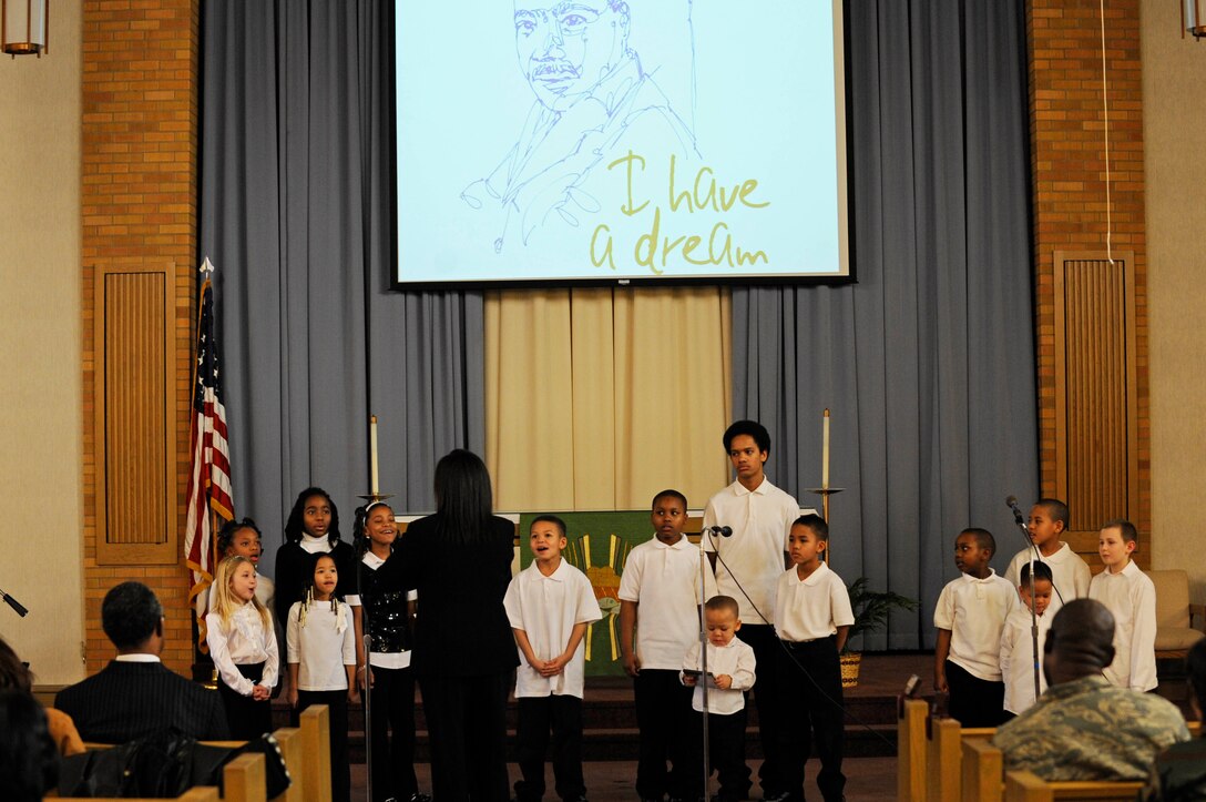 Children from the Ellsworth Inspirational Gospel Service Choir sing inspirational songs here, Jan. 15. The songs celebrated the life and legacy of Dr. Martin Luther King Jr.(US Air Force photo/Airman 1st Class Corey Hook)