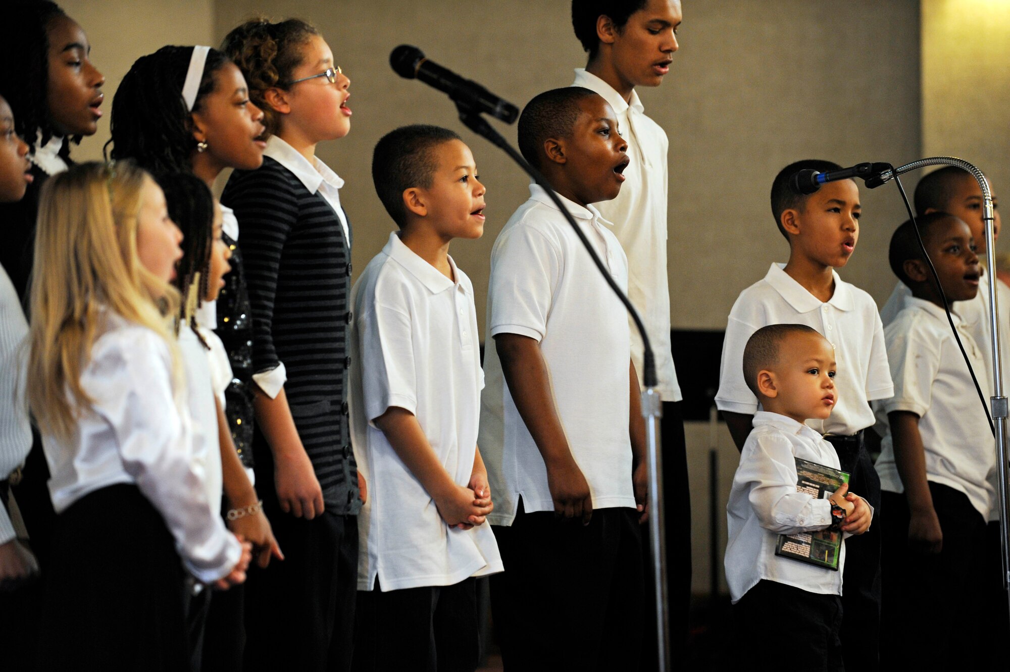 Children from the Ellsworth Inspirational Gospel Service Choir sing inspirational songs here, Jan. 15. The songs celebrated the life and legacy of Dr. Martin Luther King Jr.(US Air Force photo/Airman 1st Class Corey Hook)