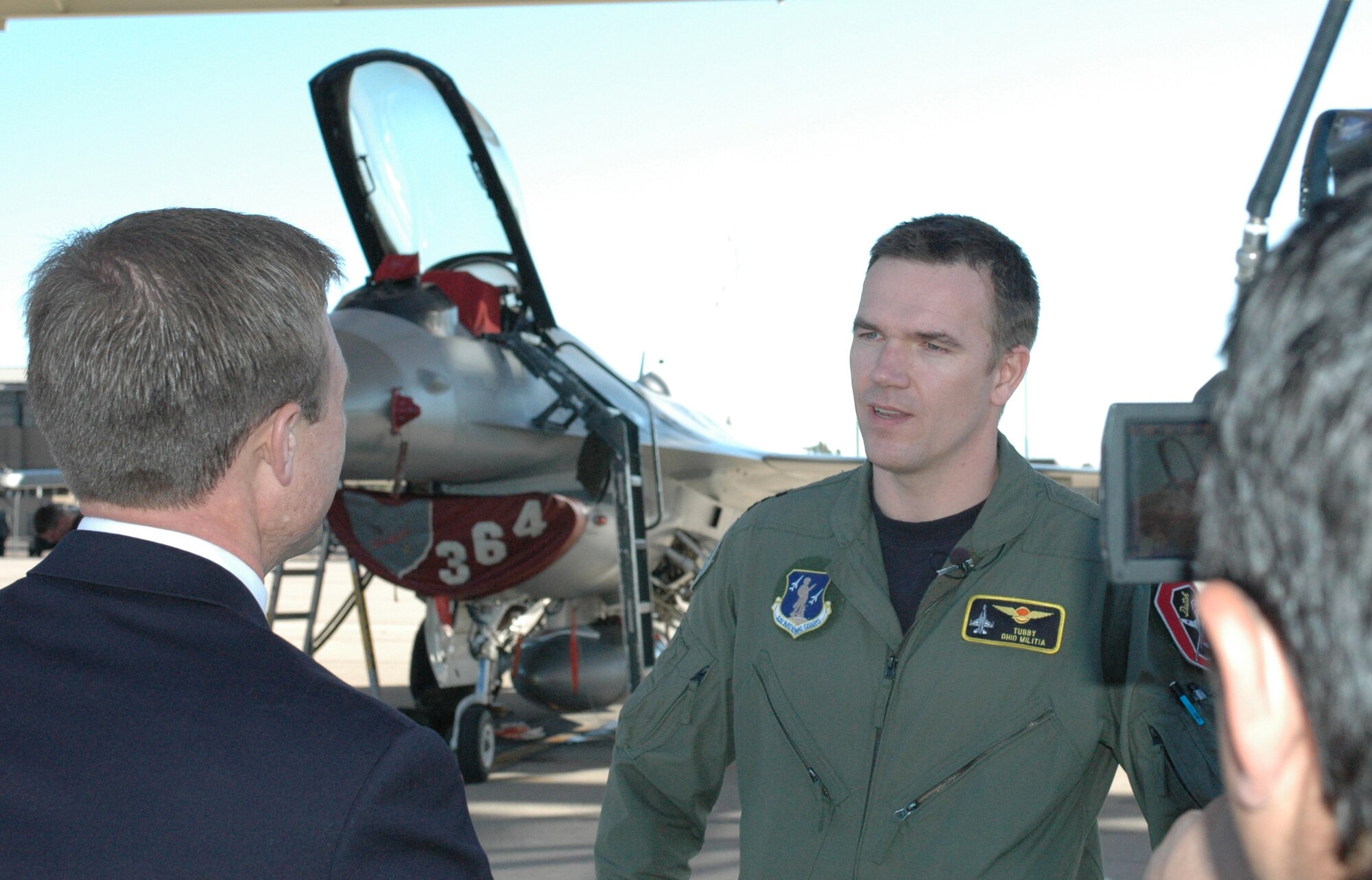 Maj. Olde Bijvank, a Royal Netherlands Air Force F-16 pilot, interviewes on the Operation Snowbird ramp at Davis-Monthan Air Force Base with KOLD, Channel 13, reporter J.D. Wallace about flying in Southern Arizona, Jan. 14. Major Bijvank, an instructor pilot with the Ohio Air National Guard, trained at the 162nd Fighter Wing at Tucson International Airport as a student pilot 12 years ago. He noted that the weather, ranges and the support of the Arizona Guard amount to ideal pilot training conditions here. The Dutch will train at Operation Snowbird Jan. 11-31 with Ohio’s 178th Fighter Wing to escape winter weather conditions in the north. (Air National Guard photo by Capt. Gabe Johnson)