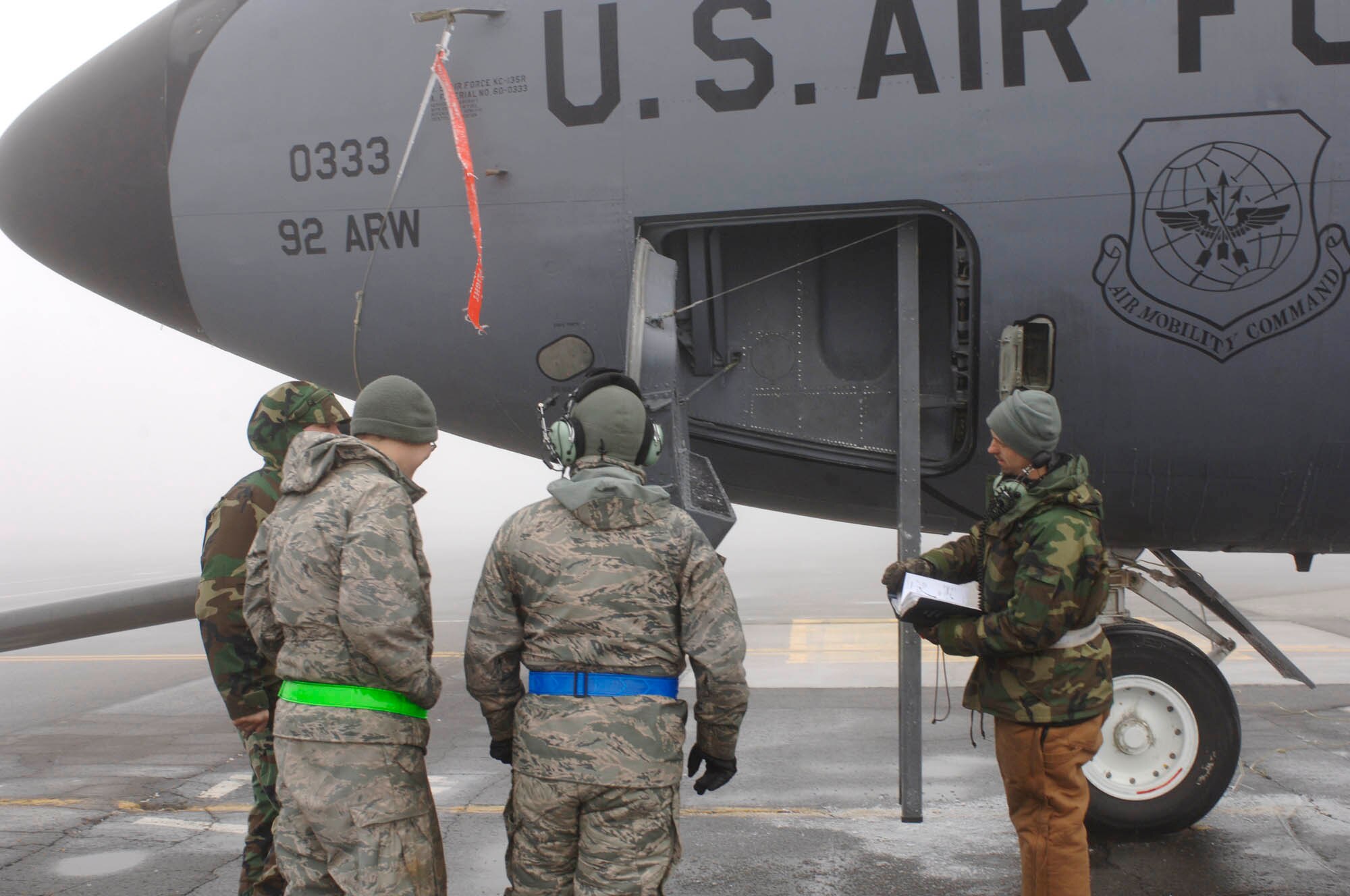 FAIRCHILD AIR FORCE BASE, Wash- 92nd Aircraft Maintenance Squadron crew chiefs receive a briefing before towing a KC-135 stratotanker on the flightline Jan. 15. While members of the 92nd ARW were on an exercise, maintainers left behind take the opportunity to focus on more of the minor issues of the planes. (U.S. Air Force photo / Airman 1st Class Darlene West)