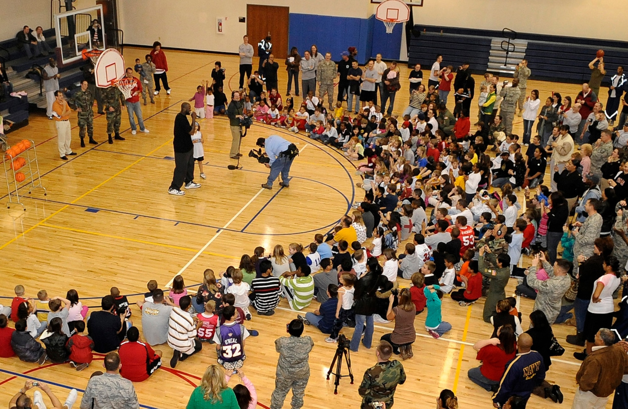 BUCKLEY AIR FORC BASE, Colo -- Shaquille O'Neal, Phoenix Suns center, talks to more than 265 military children during a basketball clinic here Jan. 14. Mr. O'Neal spoke to the children about what it was like for him growing up in a military environment. The visit was filmed and portions will air during a youth concert in Washington D.C. attended by the first and second ladies on the Disney Channel and Disney Radio Jan. 19 from 6:00 - 7:30 p.m. MST. (U.S. Air Force photo by Senior Airman Steven Czyz)