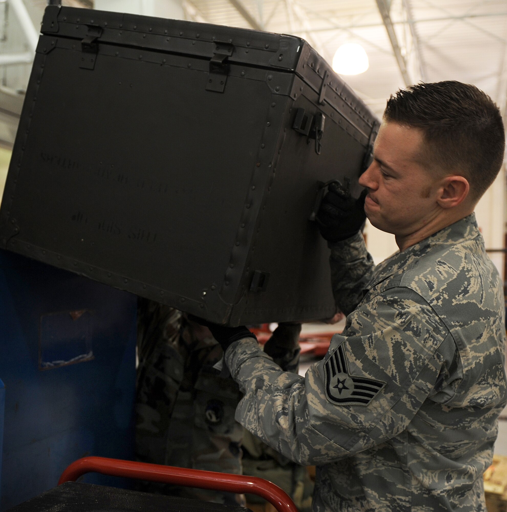 LANGLEY AIR FORCE BASE, Va. -- Staff Sgt. Jonah Nordman, 1st Logistics Readiness Squadron material control, sorts boxes of supplies to make room for more supplies Jan. 16. The 1st LRS recently won the 2008 Air Combat Command Maj. Gen. Warren R. Carter Logistics Effectiveness Award, also known as the Daedalian Award. (U.S. Air Force photo/Airman 1st Class Zachary Wolf)