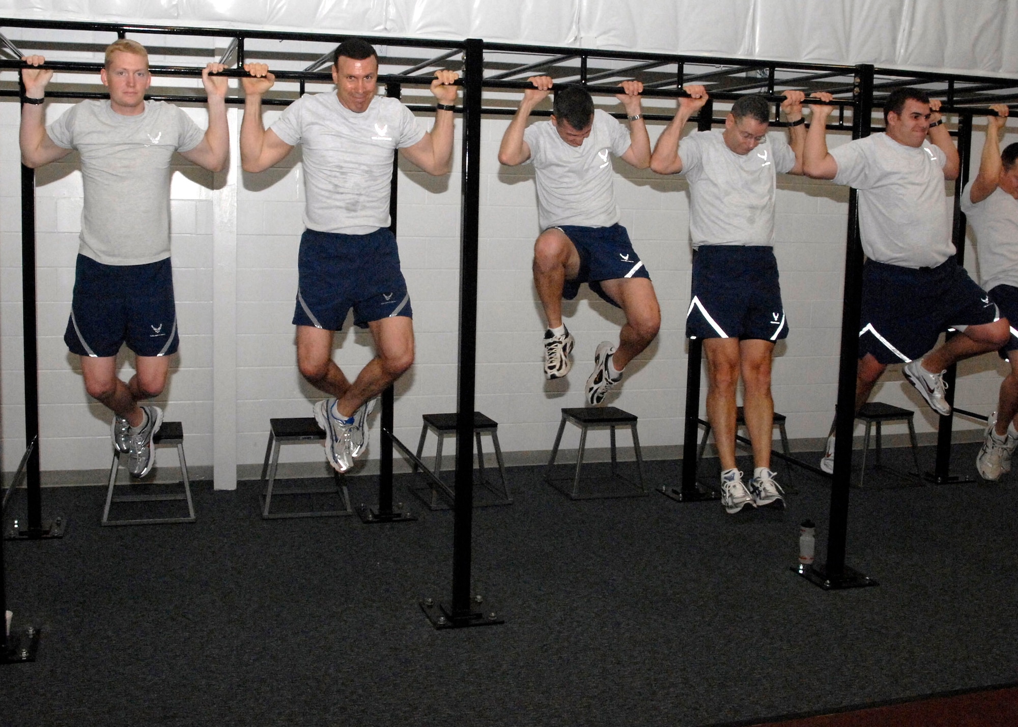 Airmen give their best during the inaugural exercise session Jan. 15 at the new Tactical Fitness Center at Andrews Air Force Base, Md.  Staff members at the center focus on programs that build the core strength and endurance that are fundamental to a superior level of combat fitness, both as individuals and as team members. (U.S. Air Force photo/Airman 1st Class Melissa Rodrigues)