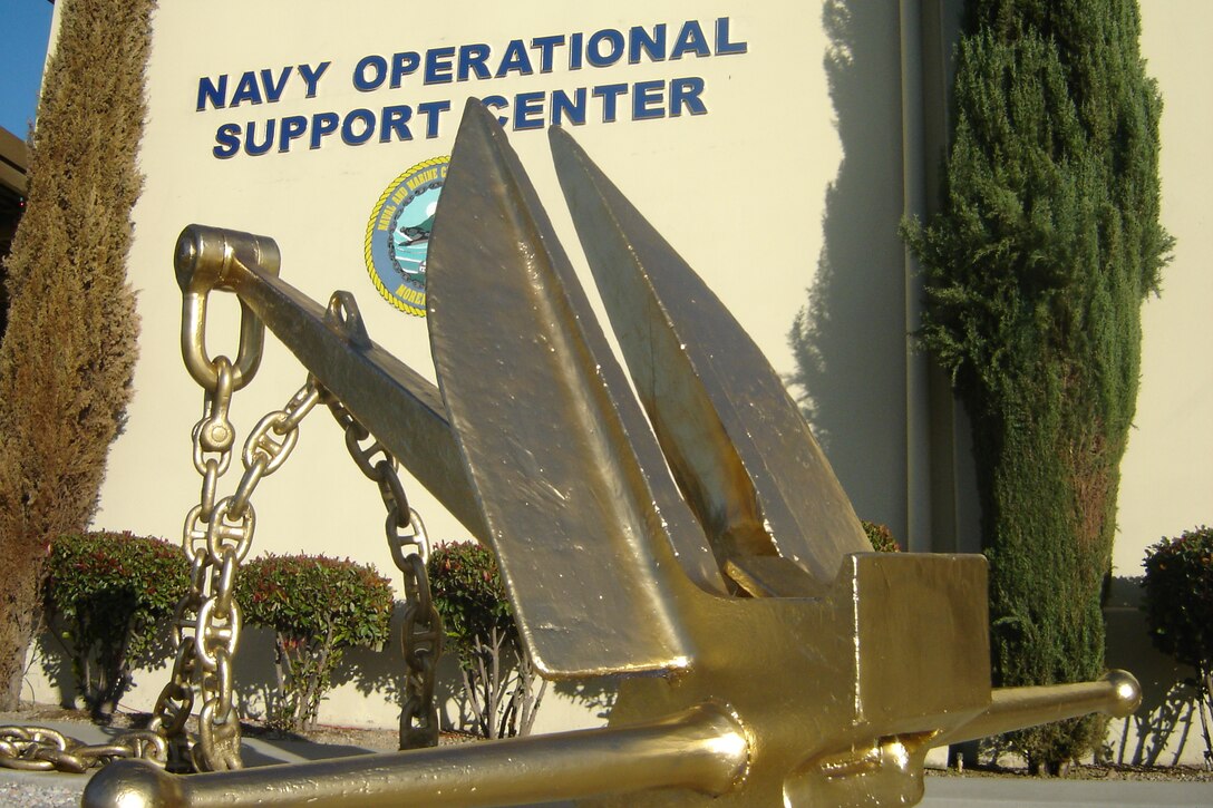 The Navy Operational Support Center recently won the right to paint its anchor gold after receiving the FY 2008 Retention Excellence Award recently. The anchor was originally blue, the color for shore commands. Anchors are usually gray aboard ships. The award recognizes NOSC for exceeding reenlistment rates across three seniority categories: 55 percent for first-termers; 66 percent for mid-graders; and above 85 percent for senior Sailors, according to Commander Steve Hartsel, NOSC’s commanding officer. “In the Navy, when you see that a ship has an anchor painted gold, you know that that ship is an excellent ship,” he said. “We have a good, solid group of Sailors here who are given the freedom to do their jobs the way they see fit.” NOSC has 23 full-time Sailors and 550 drilling reservists. (U.S. Air Force photo by Will Alexander)