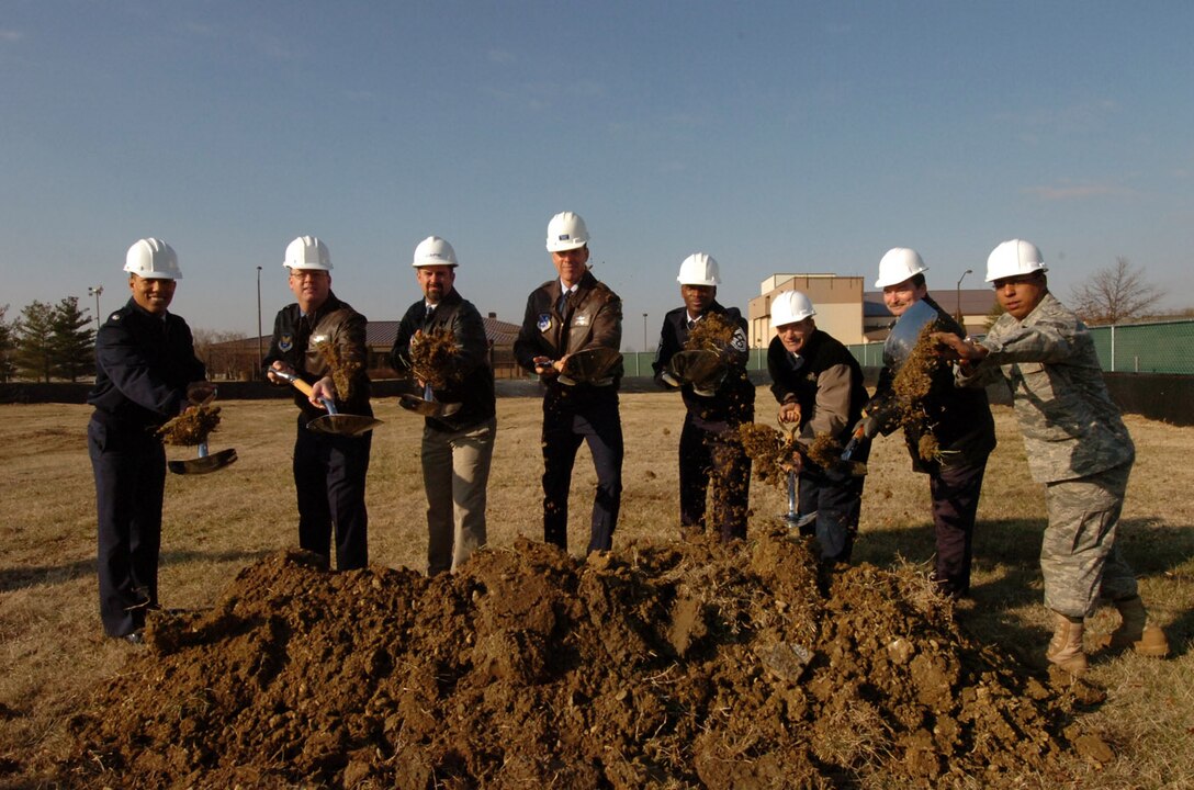 Base leaders, along with 316th Civil Engineer Squadron members, conduct a ground breaking ceremony for the new $8.3 million airfield lighting facility here Jan. 12. The new facility, which supplies power to the airfield runway lights, will include new state-of-the-art high voltage distribution equipment, a training room and maintenance work area. (U.S. Air Force photo by Bobby Jones)
