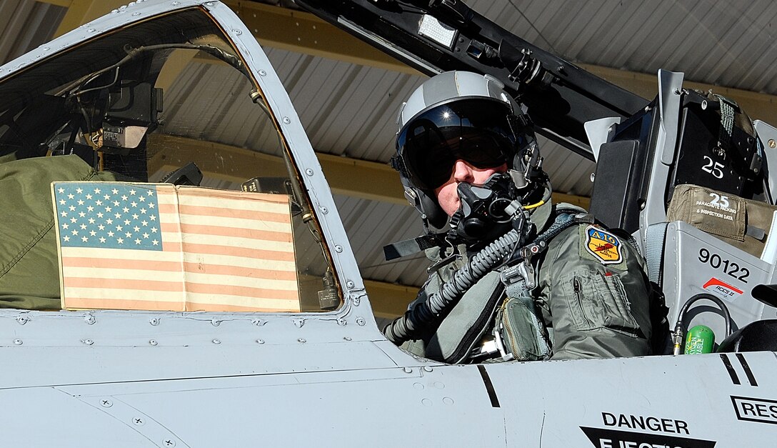 Maj. Les Bradfield, an A-10 Thunderbolt II pilot with the 303rd Fighter Squadron, looks to his aircraft crew chief, Senior Airman Andrea Sumner, prior to launching his aircraft on a local training flight Dec. 7, 2008.  The 303rd FS is part of the 442nd Fighter Wing, an Air Force Reserve Command unit based at Whiteman Air Force Base, Mo.  (U.S. Air Force photo/Staff Sgt. Tom Talbert)