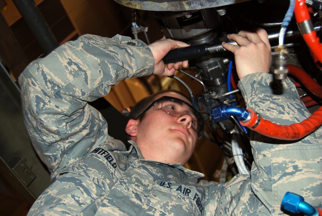 An Airman in Training at the 361st Training Squadron works on an aircraft engine Dec. 15 during a training session. (U.S. Air Force photo/John Ingle)