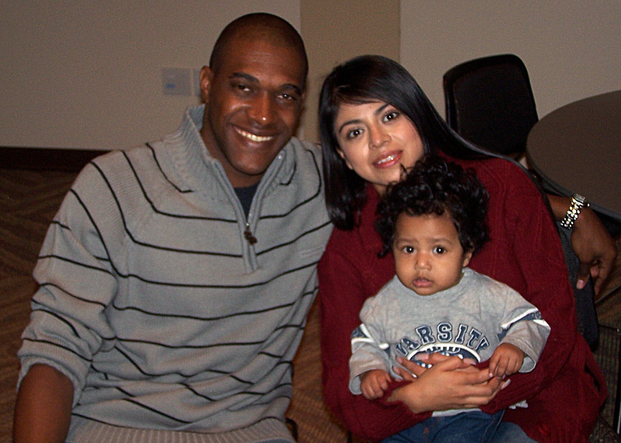 TEAM BUCKLEY WARRIOR OF THE WEEK -- Airman 1st Class Darnell Walcott, a communications project manager for the 460th Space Communications Squadron, with his wife Luz del Cielo Walcott and his son, Caleb Alexander Walcott, is Team Buckley's Warrior of the Week for Jan. 9 - 15. Airman Walcott calls El Paso, Texas, home and enjoys spending time with his family. (Courtesy photo)