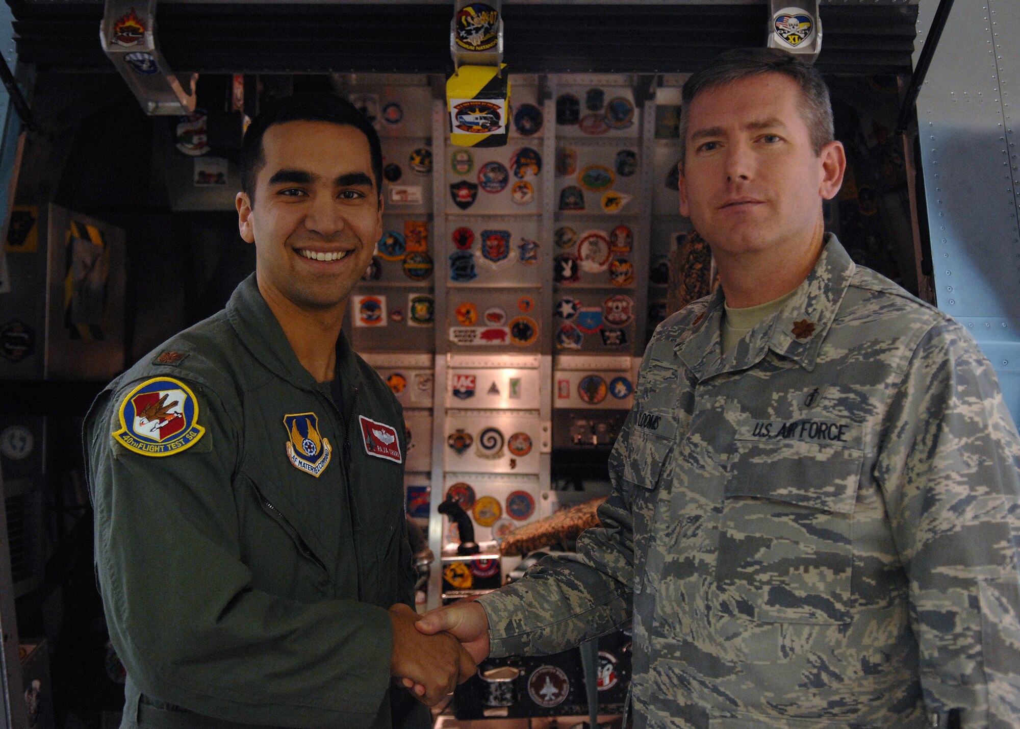 Maj. Timothy Loomis congratulates Maj. Raja Chari on being the 30,000 student to enter the centrifuge, Jan. 14, at Holloman Air Force Base, N.M.The centrifuge at Holloman AFB is operated by the aerospace physiology department for the purpose of training and evaluating prospective fighter pilots for high-g flight in Air Force fighter aircraft. (U.S. Air Force photo/ Senior Airman Anthony Nelson Jr)


