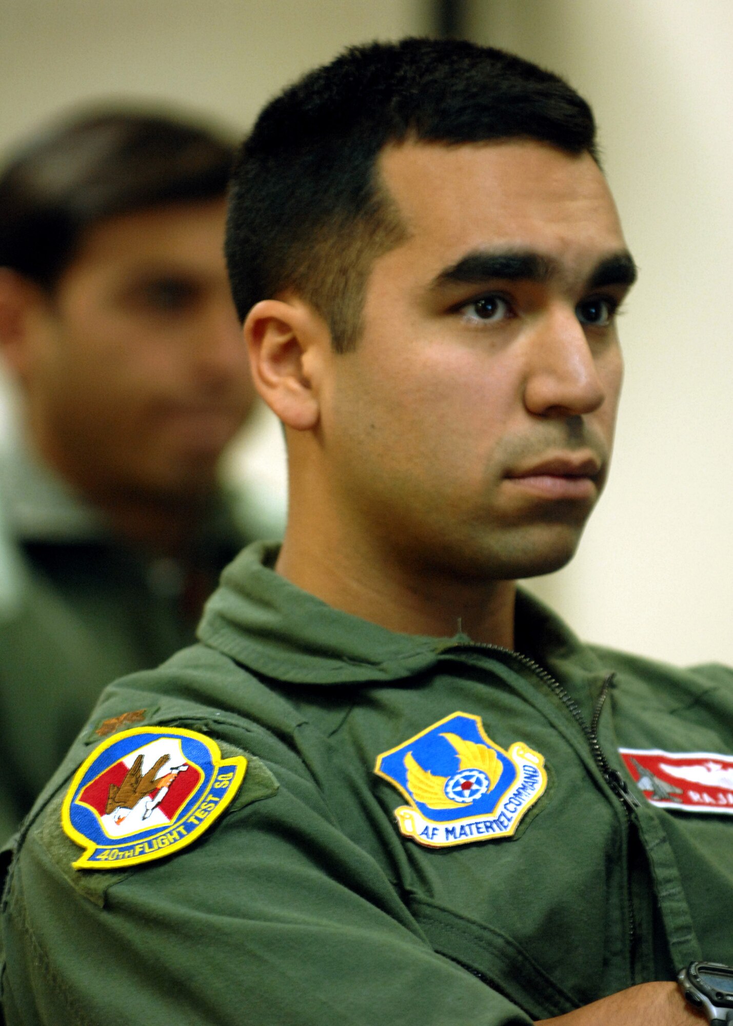 Maj. Raja Chari listens to instructor 2nd Lt. Shawnalee Bradley as she explains the protocol before getting into the human centrifuge, Jan. 14, at Holloman Air Force Base, N.M. Maj. Chari is assigned to the 40th Flight Test Squadron, 46th Test Wing, Air Force Material Command. He was the 30,000 student to go through the course. (U.S. Air Force photo/ Senior Airman Anthony Nelson)
