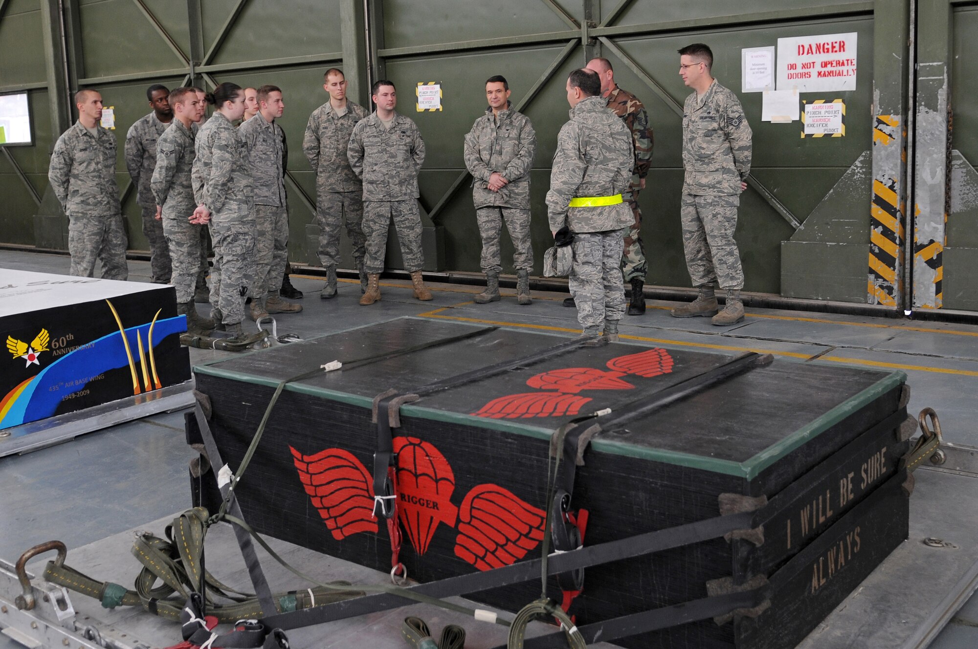 Col. Donald Bacon, 435th Air Base Wing commander, thanks all the Airmen for the hard work put into the heavy-cargo boxes at Ramstein Air Base Jan. 16, 2009. Airmen in the 435th Logistics Readiness Squadron painted each of the heavy-cargo boxes with different tributes to military and U.S. events such as September 11 and Pearl Harbor. Their latest tribute was to Colonel Bacon and the 435th ABW. (U.S. Air Force photo by Airman 1st Class Grovert Fuentes-Contreras)