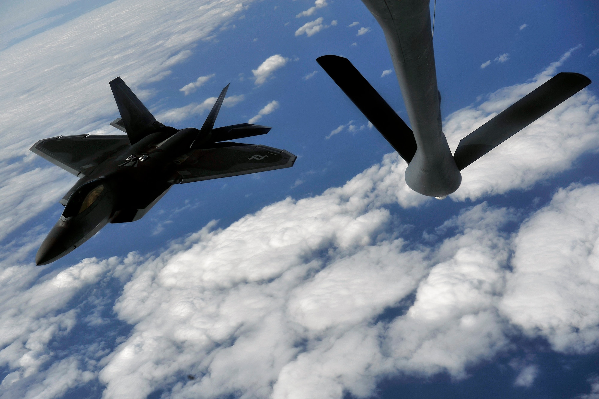 An F-22 Raptor prepares to be refueled by a KC-135 Stratotanker Jan. 15. The F-22 is deployed to Kadena Air Base, Japan, from the 27th Fighter Squadron at Langley Air Force Base, Va., in support of U.S. Pacific Command. (U.S. Air Force photo/Senior Airman Clay Lancaster) 
