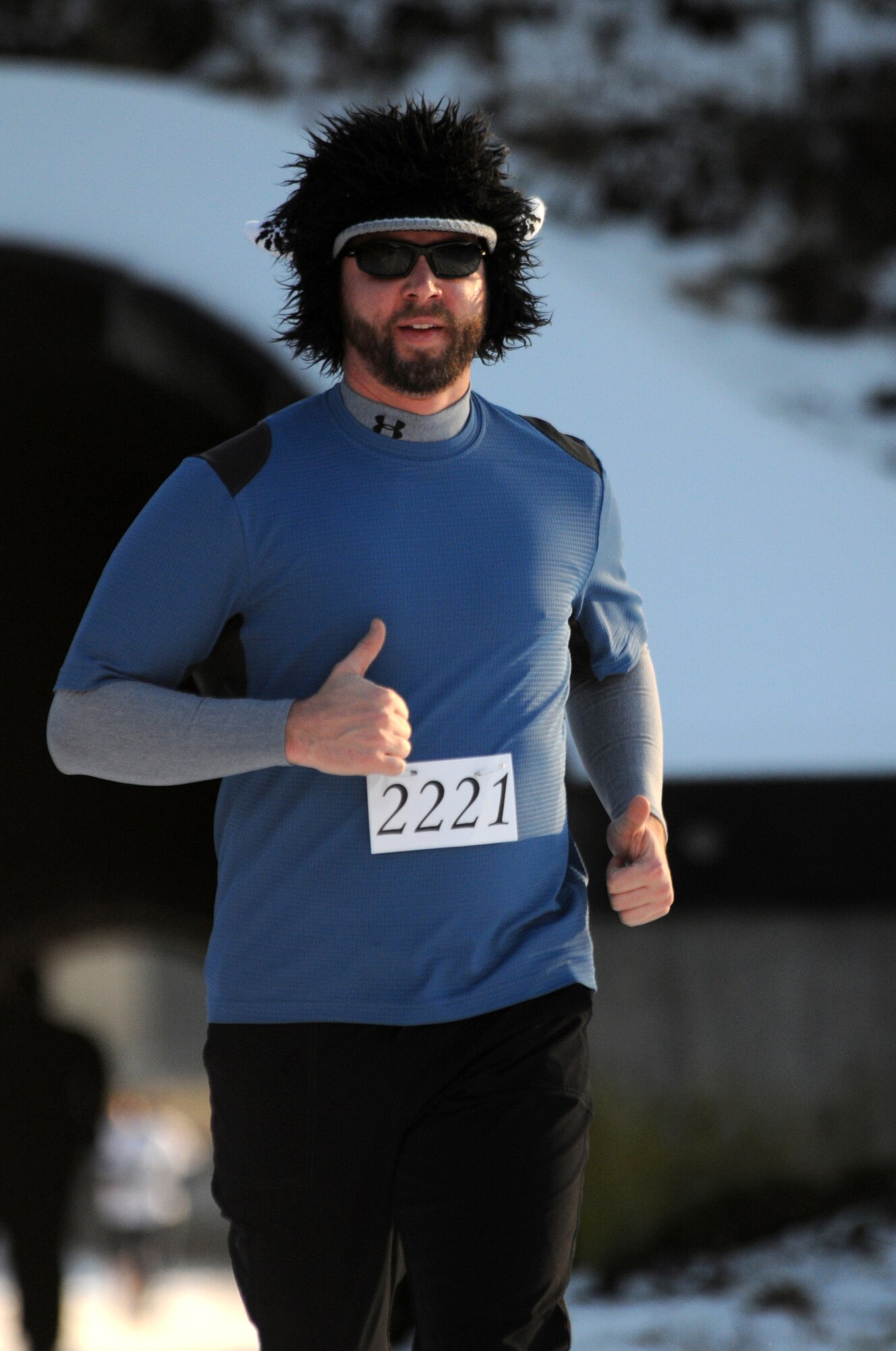 Dan Scheffer runs in the Penguin Prediction Run Jan. 15, 2009, on the 86th Construction and Training Squadron compound at Ramstein Air Base. The run, which is to be an annual event, was held to promote fitness and increase awareness of the challenges facing abandoned women and children in Pristina, Kosovo.  (U.S. Air Force photo by Senior Airman Nathan Lipscomb)