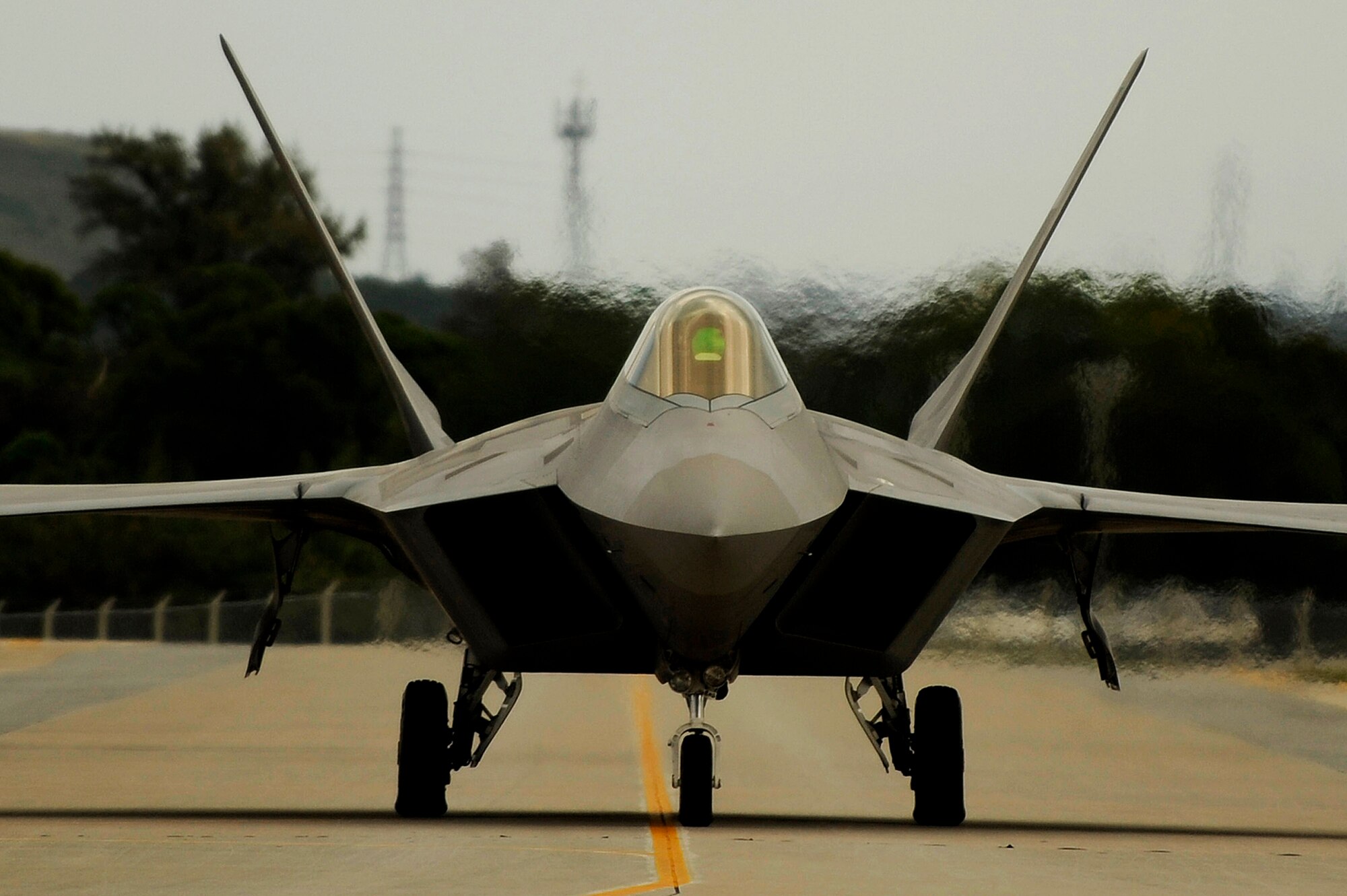 An F-22 Raptor taxies down the ramp for a mission Jan. 14 at Kadena Air Base, Japan. The F-22 is deployed from the 27th Fighter Squadron Langley Air Force Base, Va. in support of U.S. Pacific Command. (U.S. Air Force photo/Master Sgt. Andy Dunaway) 