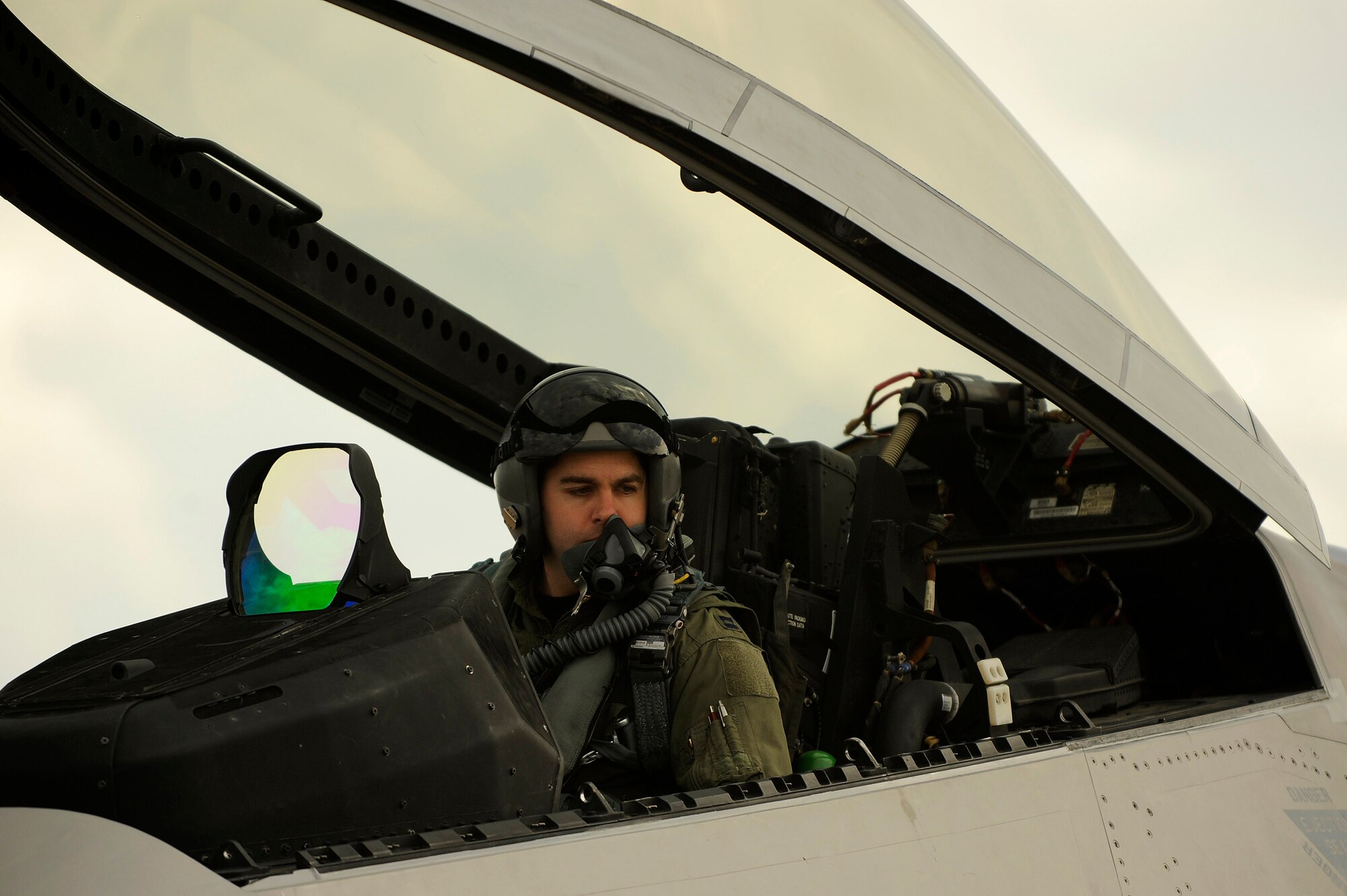 Capt. Jonathan Airhart prepares to start the engine while strapped in an F-22 Raptor prior to a mission Jan. 14 at Kadena Air Base, Japan. The F-22 is deployed from the 27th Fighter Squadron Langley Air Force Base, Va. in support of U.S. Pacific Command. Captain Airhart is a 27th FS pilot. (U.S. Air Force photo/Master Sgt. Andy Dunaway) 

