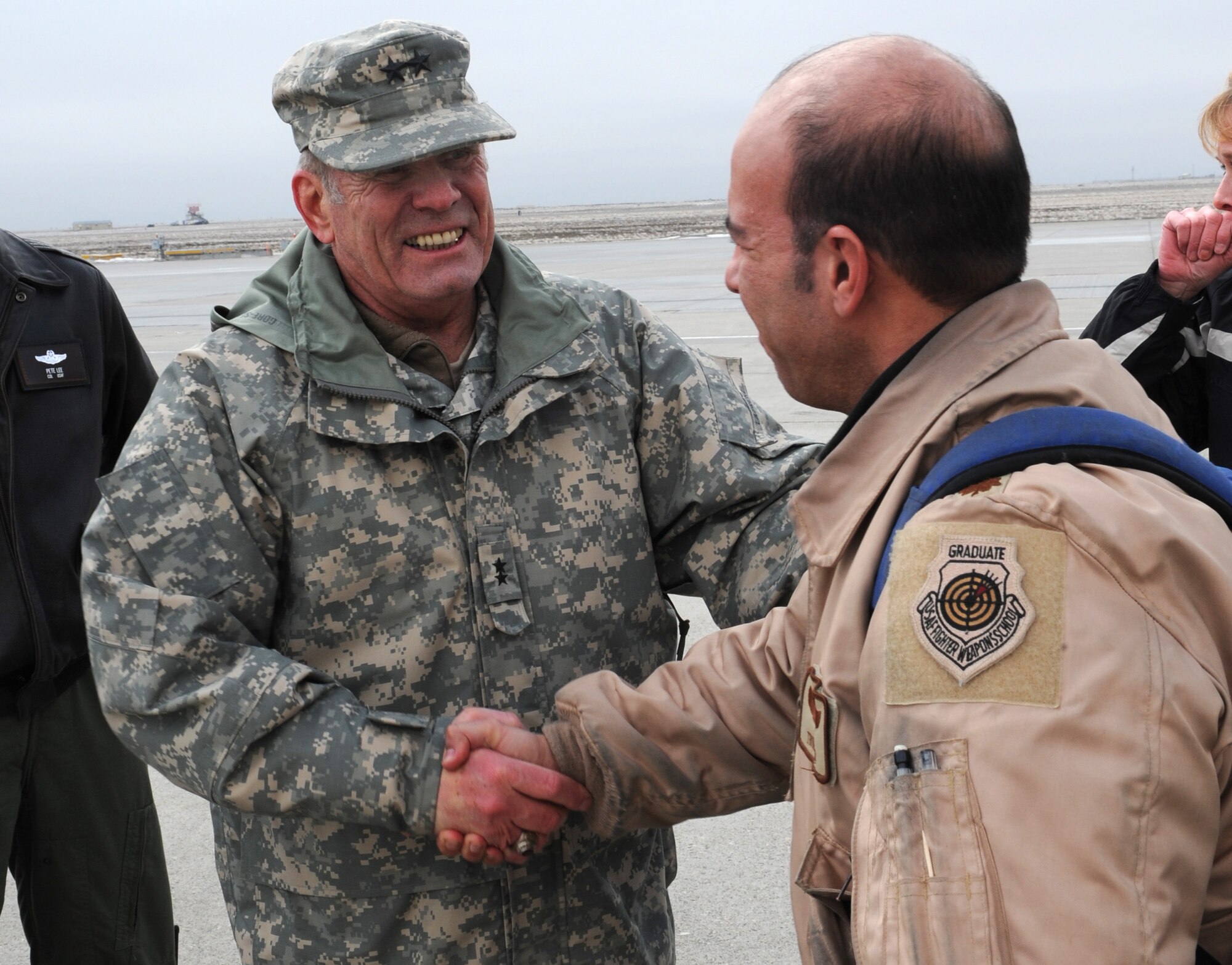 MOUNTAIN HOME AIR FORCE BASE, ID -- Maj. Gen. Lawrence Lafrenz, Adjutant General of the Idaho National Guard, shakes hands with members of the 391st Fighter Squadron on behalf of the governor of Idaho, as they return from their deployment Jan 15. Approximately 400 Gunfighters return to Idaho following more than four months of combat operations in Afghanistan in support of Operation Enduring Freedom. (U.S. Air Force photo by Airman First Class Debbie Lockhart)