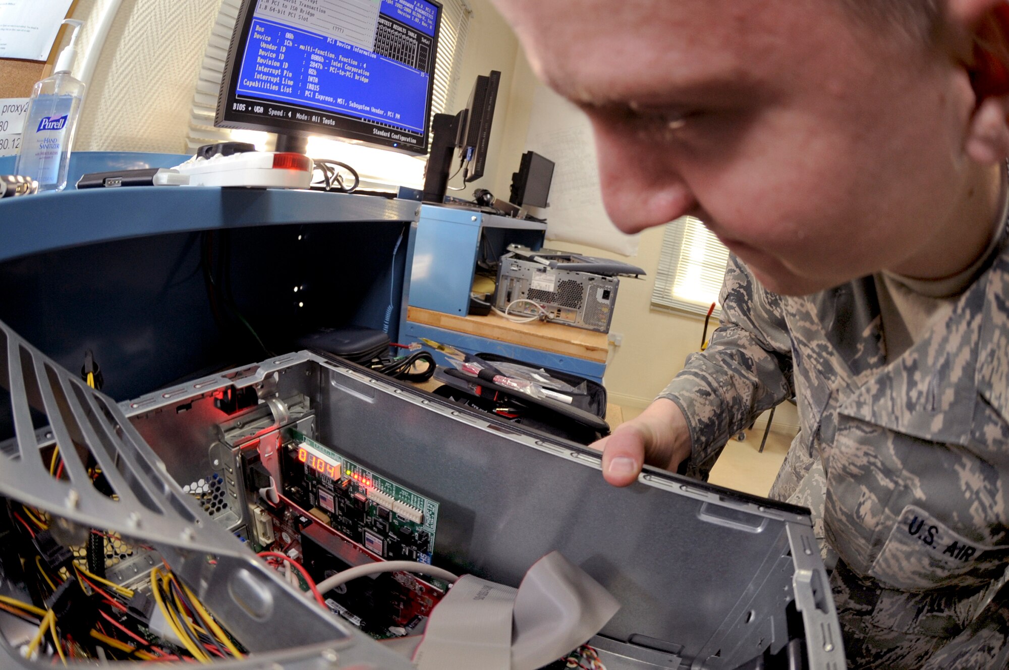 Senior Airman Ben Ward, a small computers technician with the 379th Expeditionary Communication Squadron, runs a diagnostic test on the Peripheral Component Inter-connect (PCI) of a computer, Jan. 15, 2009, in an undisclosed location in Southwest Asia.  The PCI allows external devices to successfully interface with computer components.  Airman Ward is a member of the 153rd Air Lift Wing of the Wyoming Air National Guard, his hometown is Cheyenne Wyo. and he is currently deployed in support of Operations Iraqi and Enduring Freedom and Joint Task Force-Horn of Africa.  (U.S. Air Force Photo by Staff Sgt. Joshua Garcia/Released)