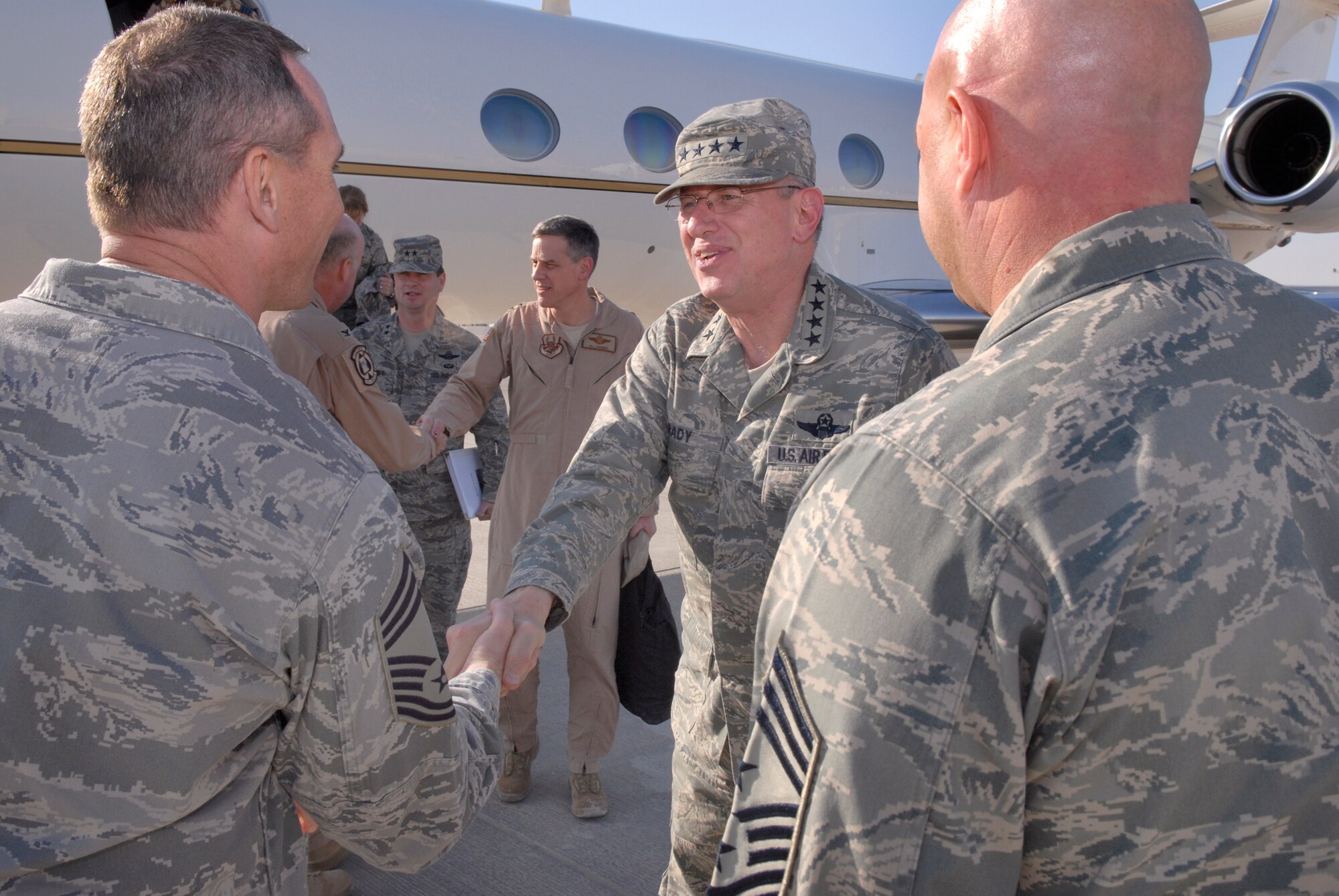 General Roger Brady, Commander of U.S. Air Forces in Europe, is greeted by Chief Master Sgt. Bryce Maxson, Combined Air and Space Operations Center Superintendent, during his visit Jan 14, 2009, in an undisclosed location in Southwest Asia.  Gen. Brady met with many Airmen and visited sites around the base in support of Operation Iraqi and Enduring Freedom and Joint Task Force- Horn of Africa.  (U.S. Air Force Photo by Airman 1st Class Andrew Satran/Released)