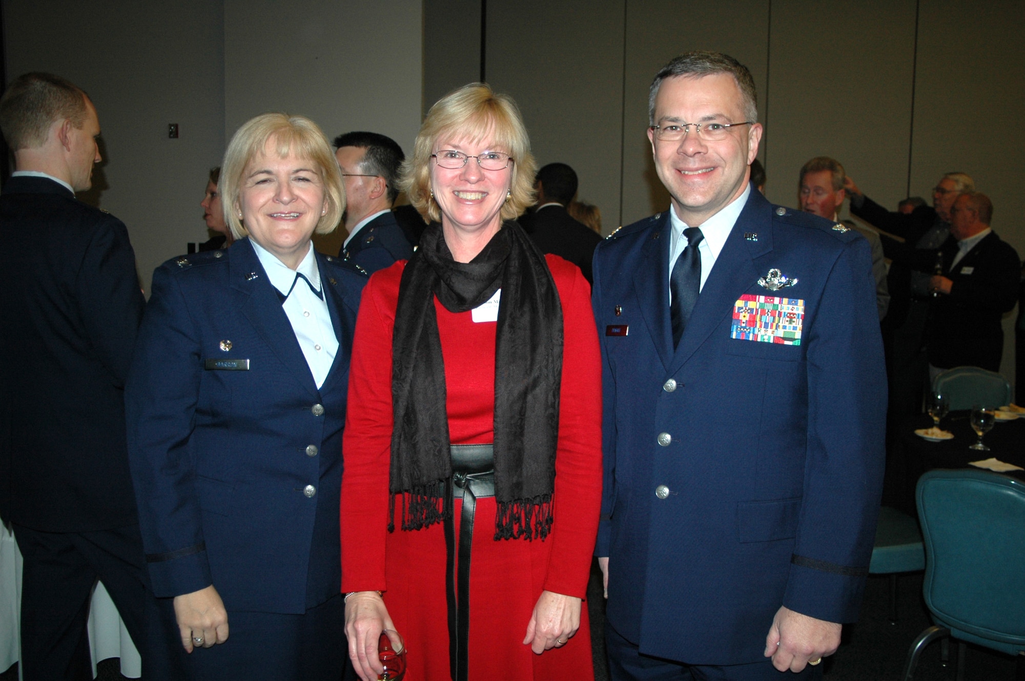 DOVER AIR FORCE BASE, Del. -- From left, Col. Elaine K. Barron, 512th Mission Support Group commander, Pam Marecki, Bayhealth Medical Center assistasnt vice president of marketing, and Col. Randal L. Bright, 512th Airlft Wing commander attended the Military Affaire held at the Landings here Jan. 16. The Militray Affaire is the annual get-to-know-you mixer sponsored by the Central Delaware Chamber of Commerce. (U.S. Air Force photo/Senior Airman Andria J. Allmond)