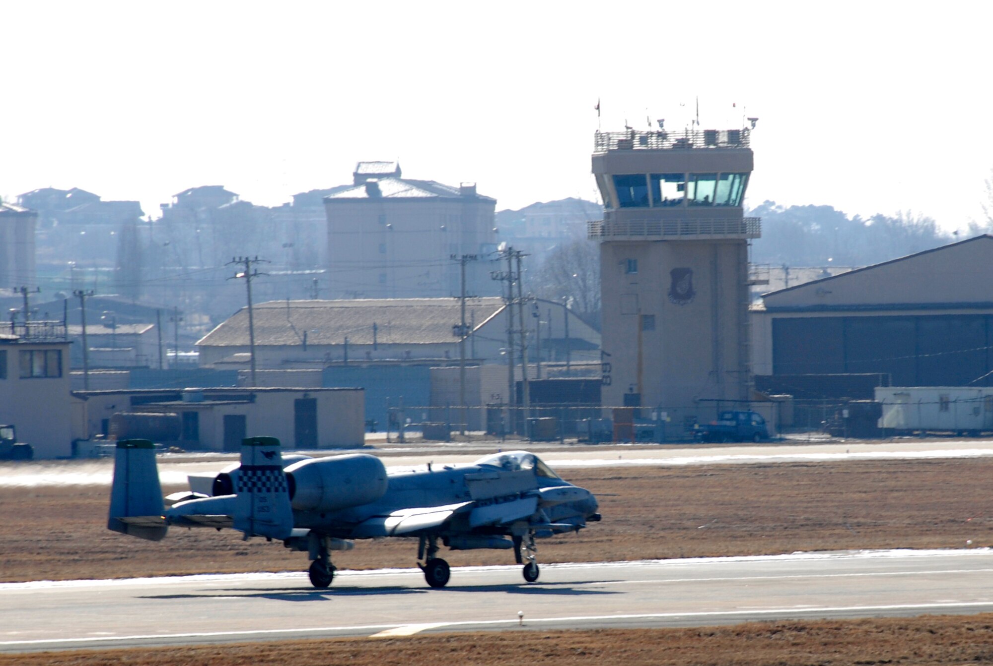 An A-10 Thunderbolt II taxies off the runway after completing a sortie during Exercise Beverly Bulldog 09-01 on Osan Air Base Jan. 15. The 51st Fighter Wing is currently undergoing a week-long Operational Readiness Exercise to test its ability to conduct war time missions. (US Air Force photo by Staff Sgt. Scottie T. McCord)