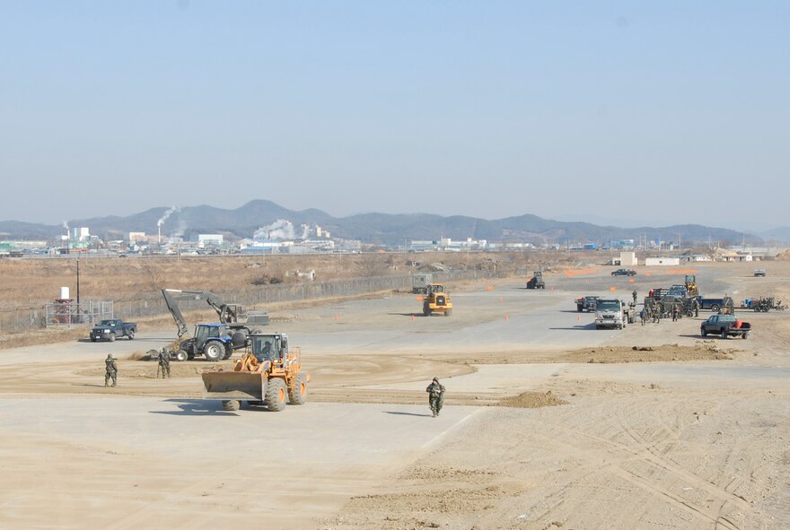 Airmen from the 51st Civil Engineer Squadron Airfield Damage Repair team perform maintenance to the airfield after a simulated attack during Exercise Beverly Bulldog 09-01 on Osan Air Base Jan. 15 The 51st Fighter Wing is currently undergoing a week-long Operational Readiness Exercise to test its ability to conduct war time missions. (US Air Force photo by Staff Sgt. Scottie T. McCord)